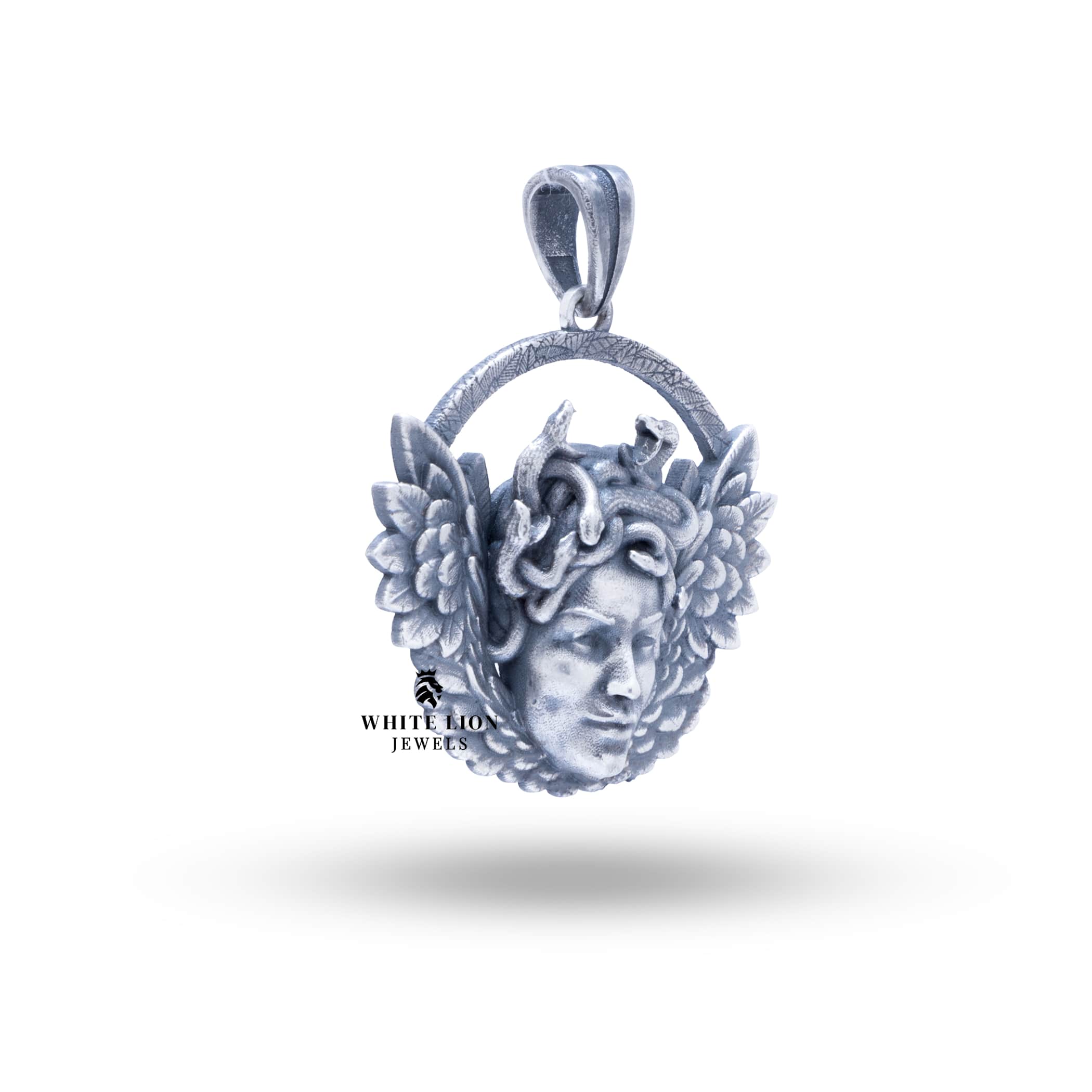 Side view showcasing the details of Medusa Wings Pendant in oxidized silver