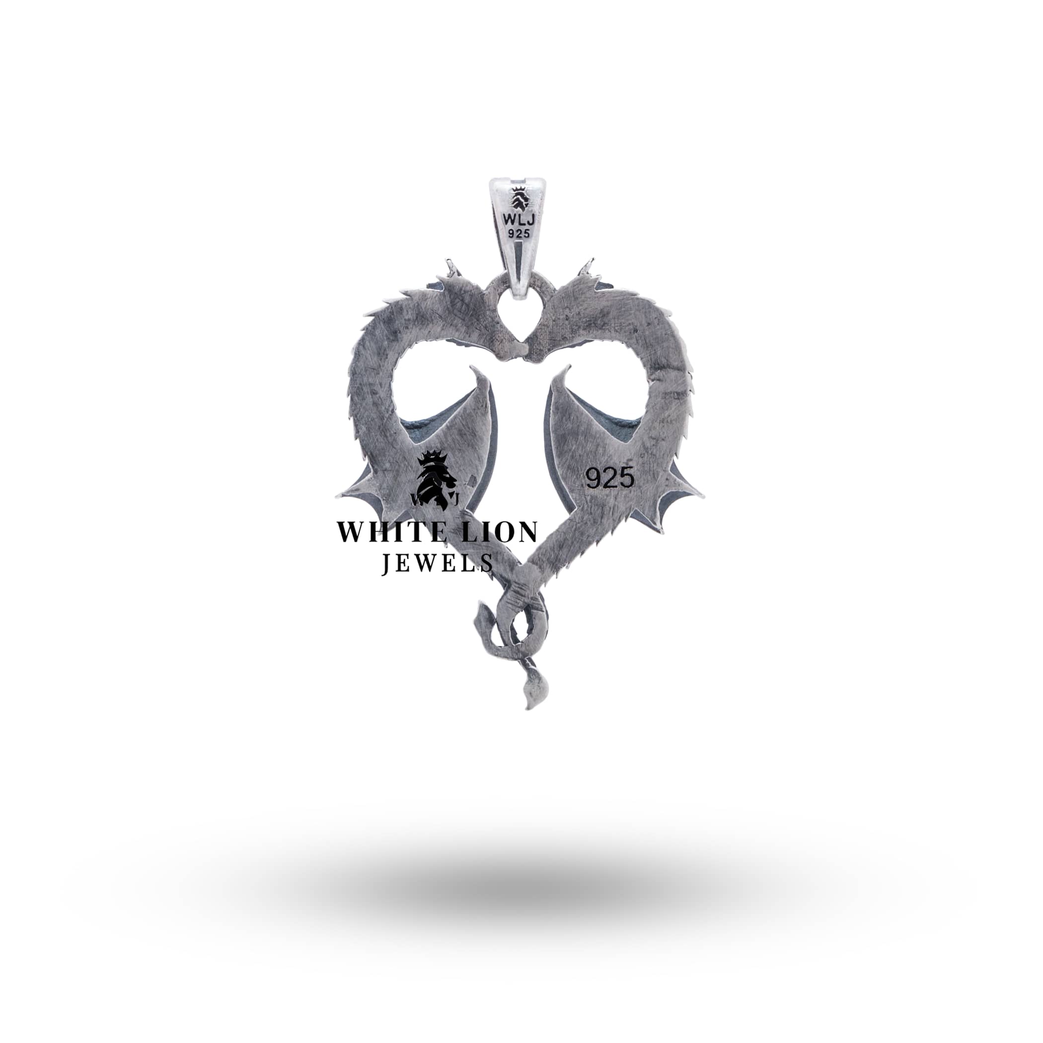 Artisanal pendant with fantasy theme, showing a dragon in a heart, made of oxidized 925 sterling silver.