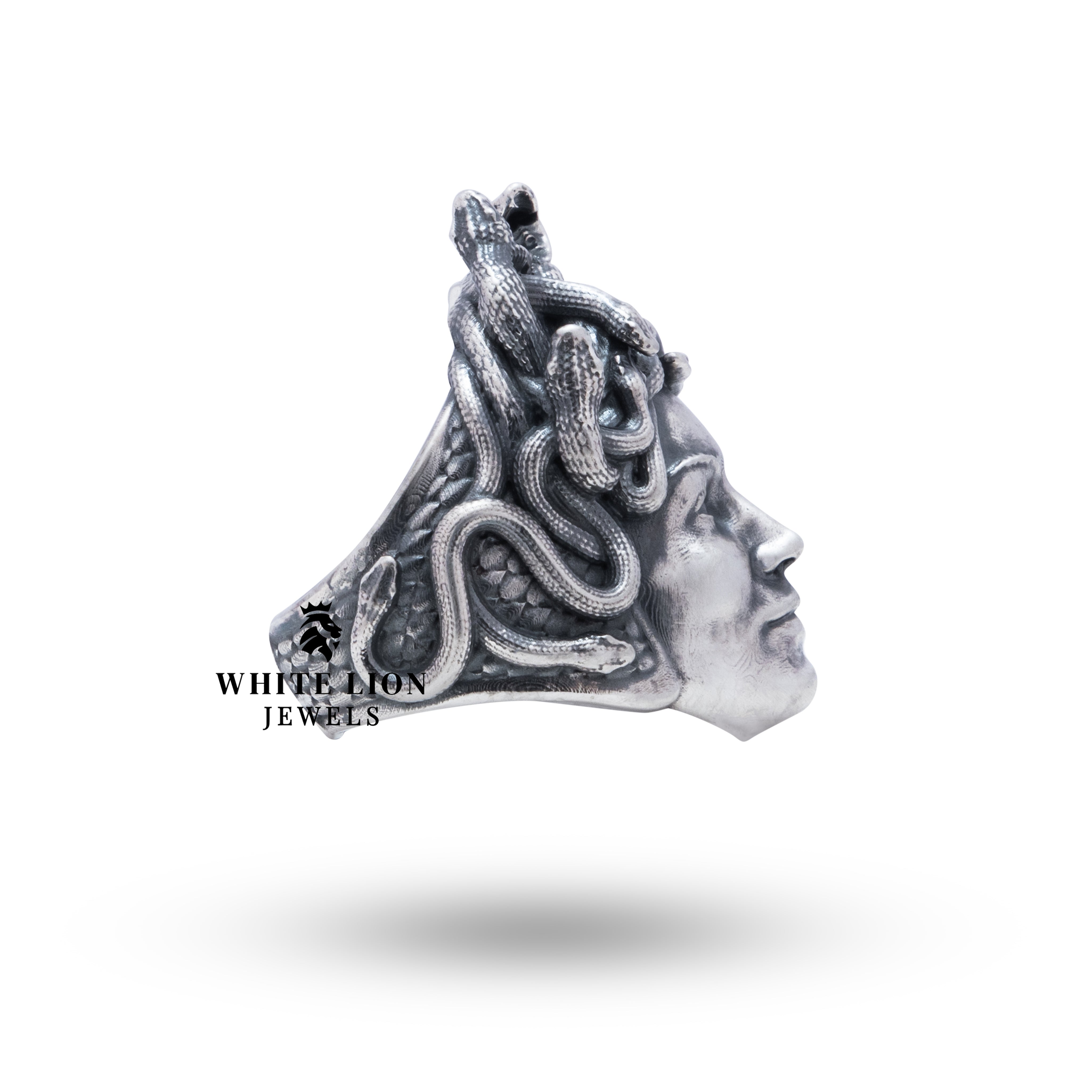 Lifestyle shot of the Medusa 925 Sterling Silver Ring, paired with elegant eveningwear.