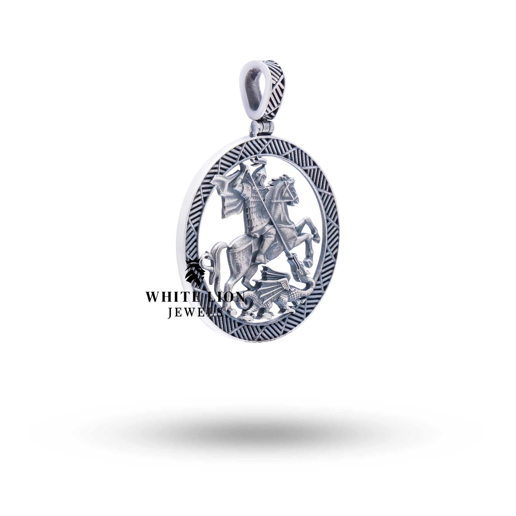 Side view of St George Pendant highlighting the circular shape and oxidized silver design.