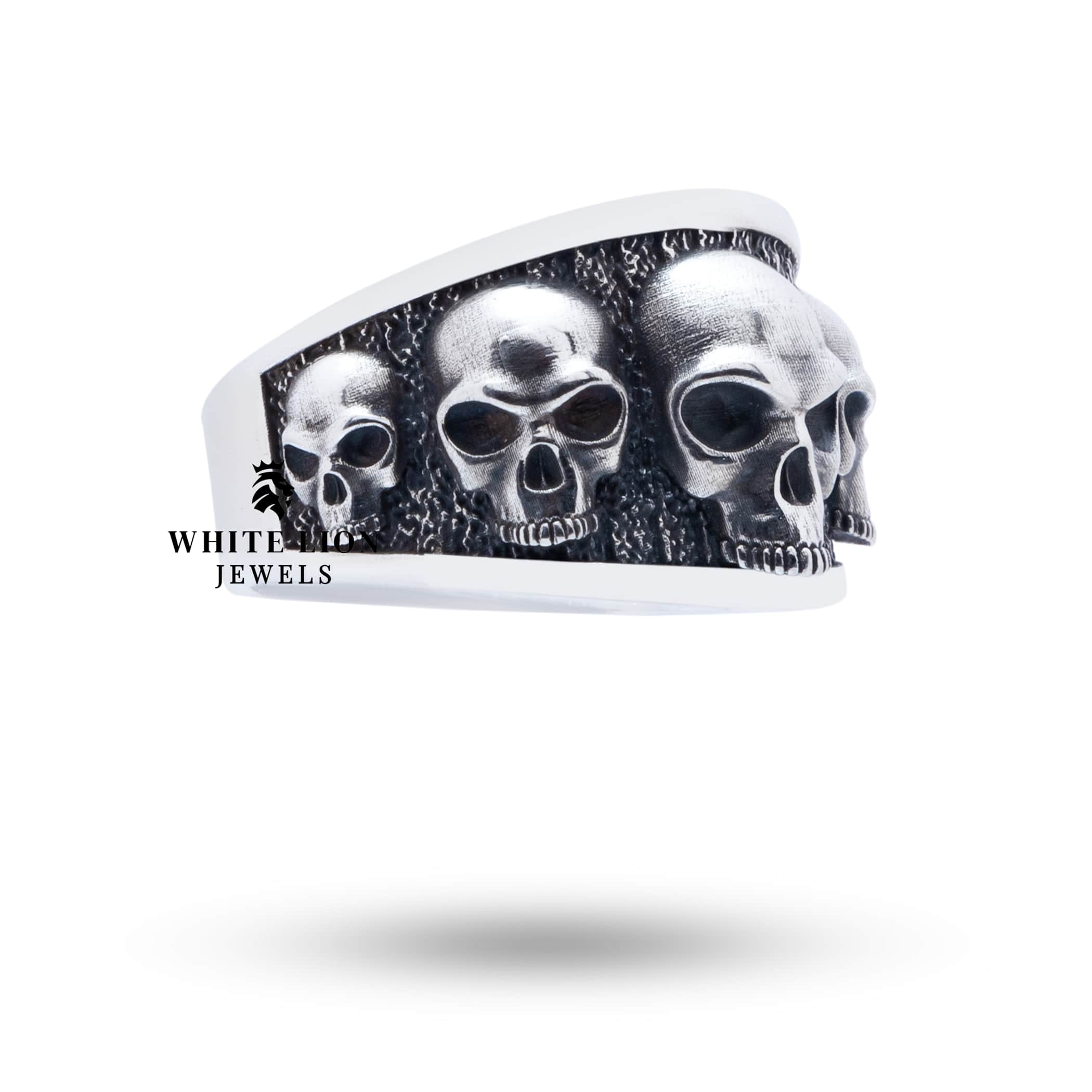 Top view of Five Skulls 925 Sterling Silver Ring highlighting intricate design.