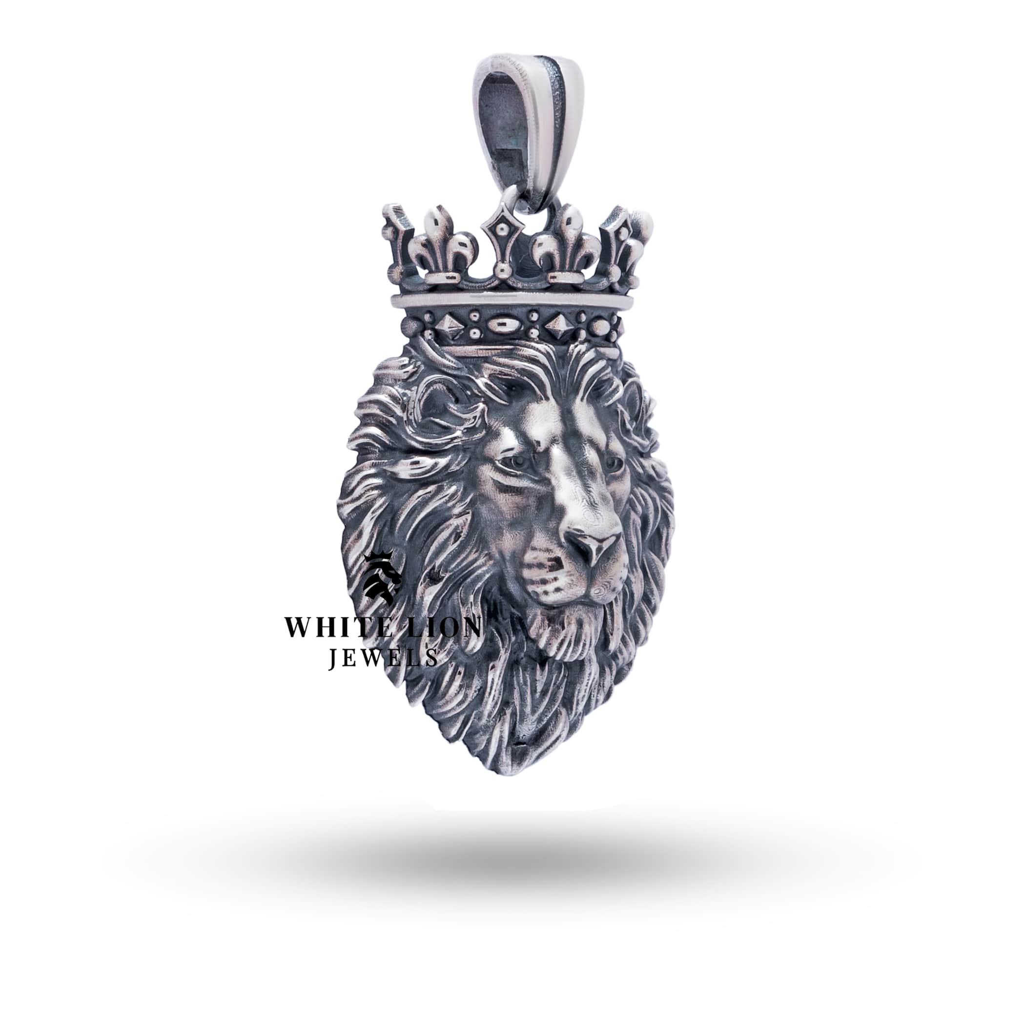 Oxidized silver lion king crown pendant with clear protective coating, elegant and regal.