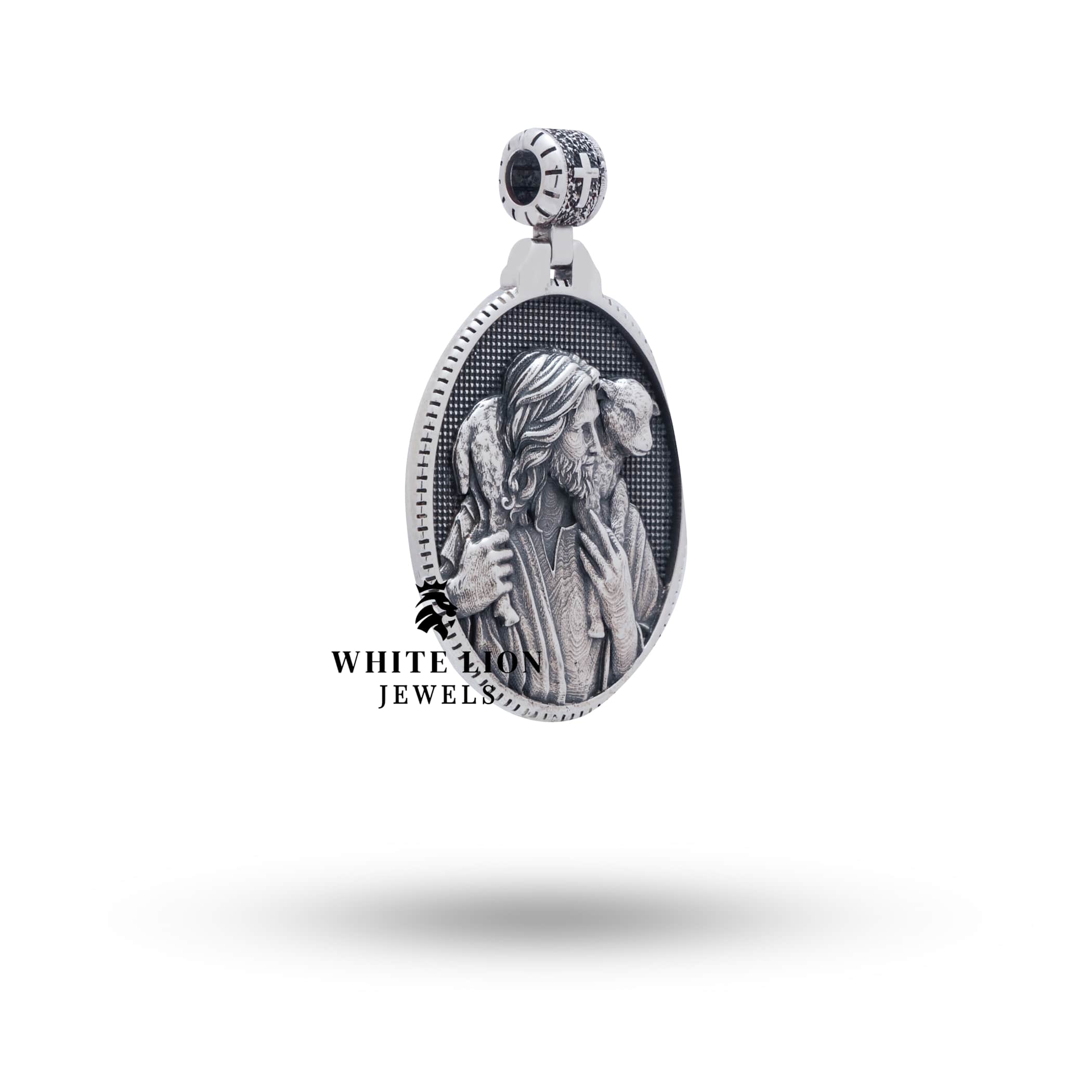 Side view of handcrafted Jesus Shepherd 925 Sterling Silver Pendant showcasing the oxidized silver texture and detailed artwork