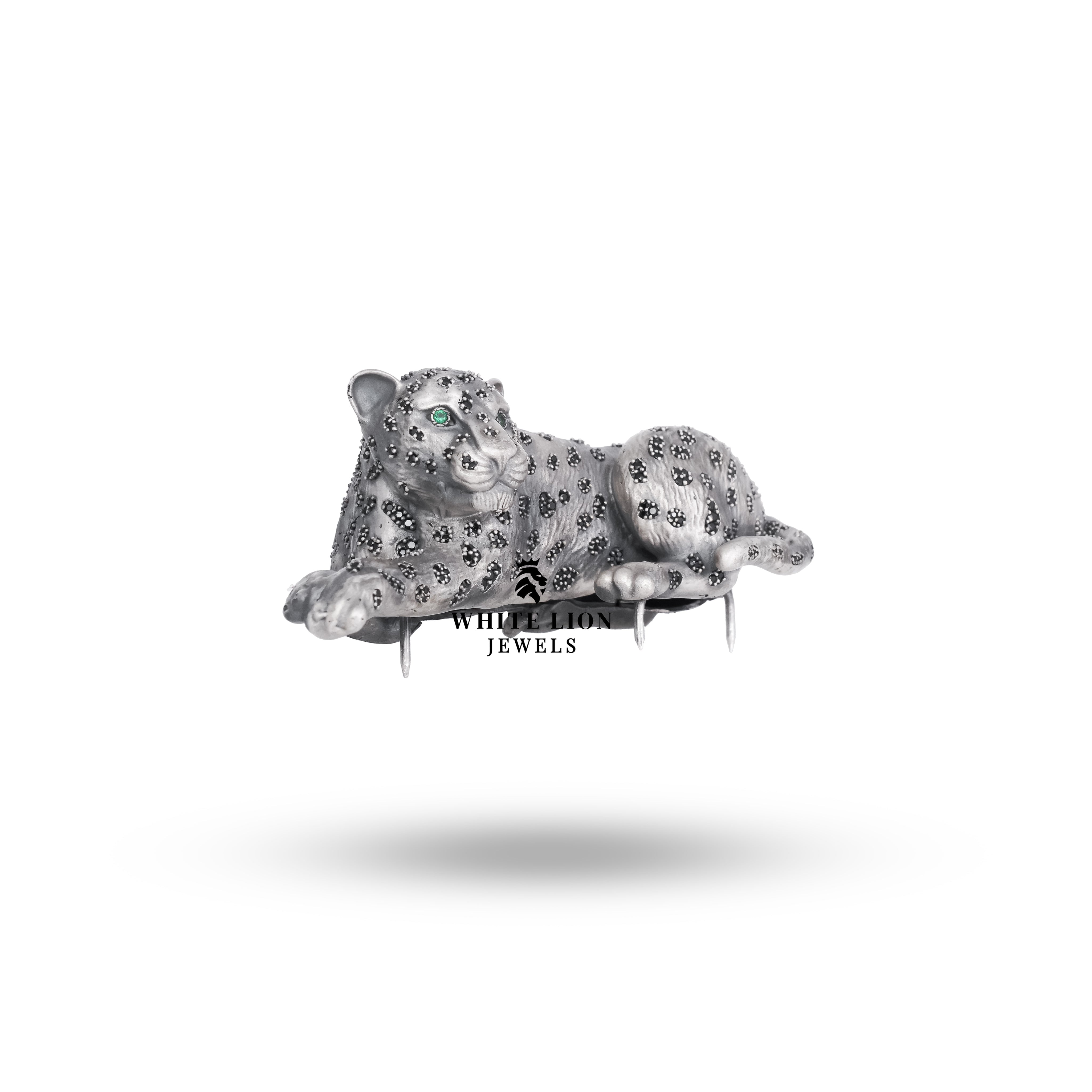 Close-up of the handcrafted oxidized silver panther brooch showcasing intricate details