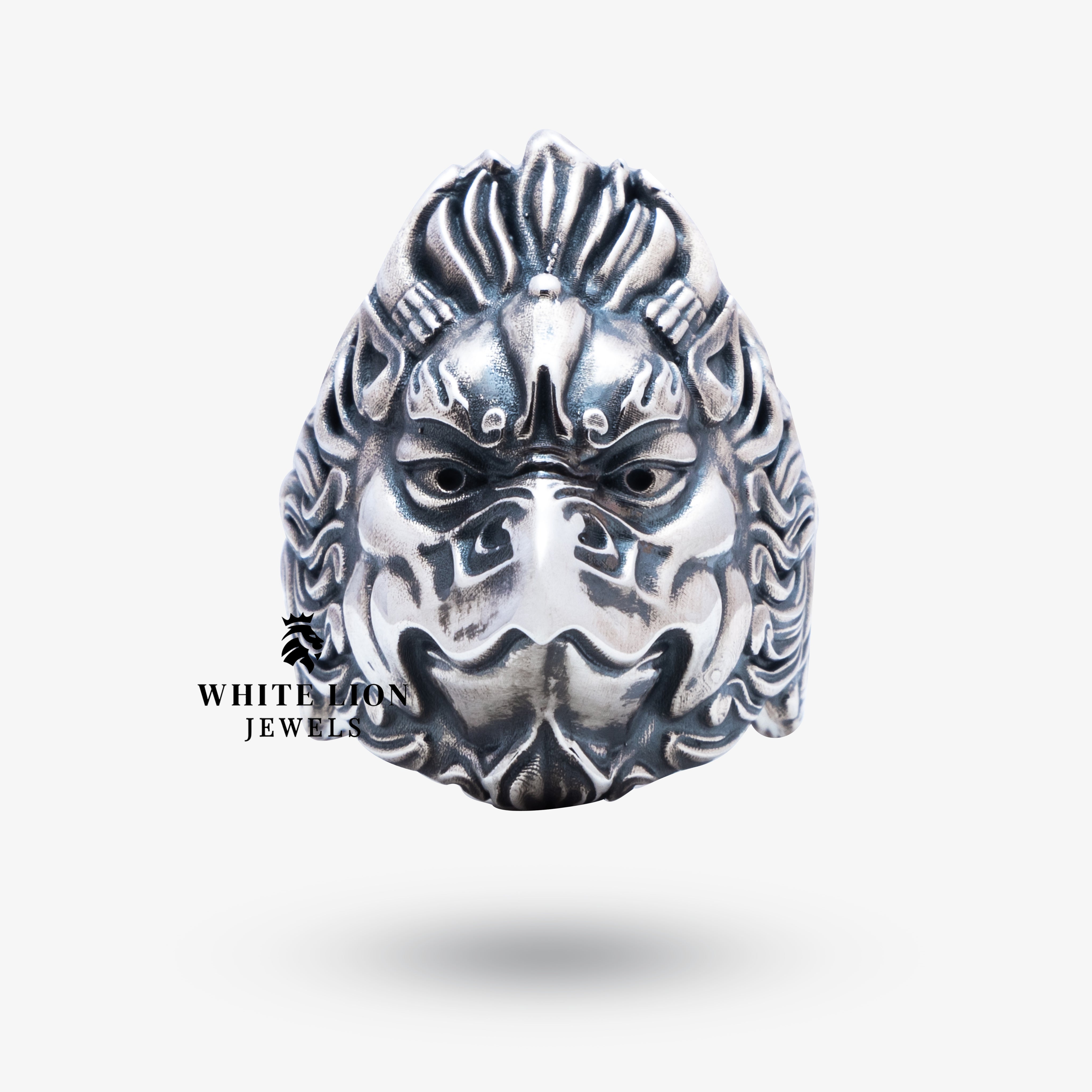 Side view showing intricate details of the Garuda design on sterling silver ring