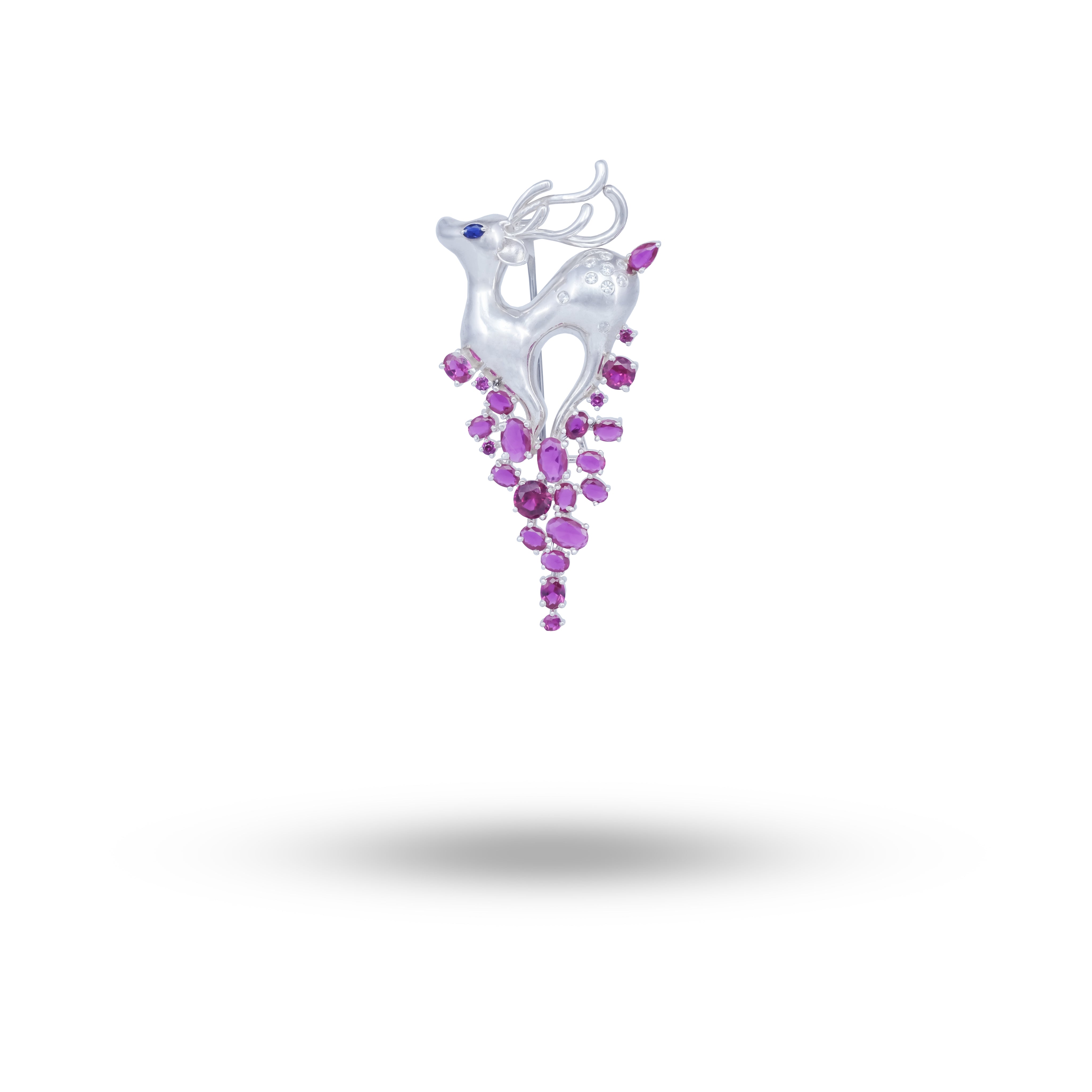 Front view of the Deer Brooch featuring ruby stones and sterling silver finish.