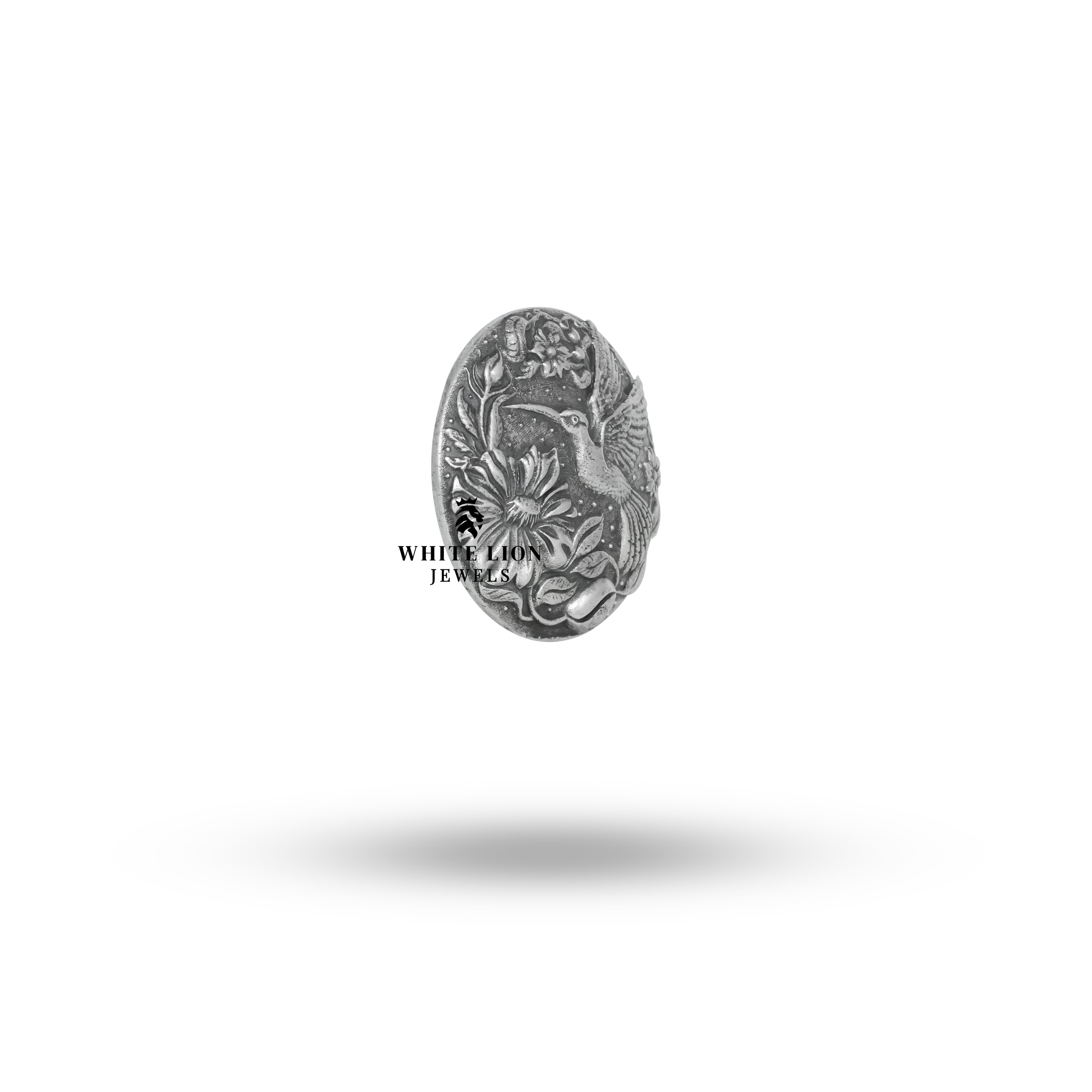 Close-up detail of the oxidized silver Humming Bird Button Set highlighting intricate craftsmanship.