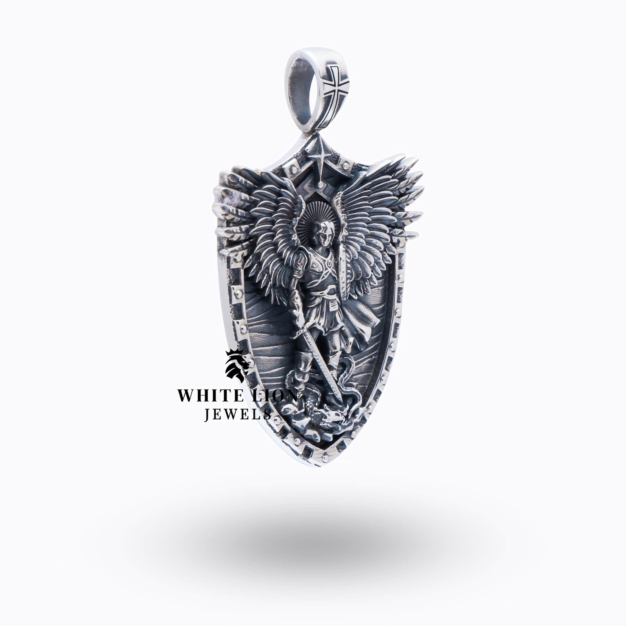 Side angle of St Michael Peiercing Devil Pendant in 925 Sterling Silver highlighting the craftsmanship.