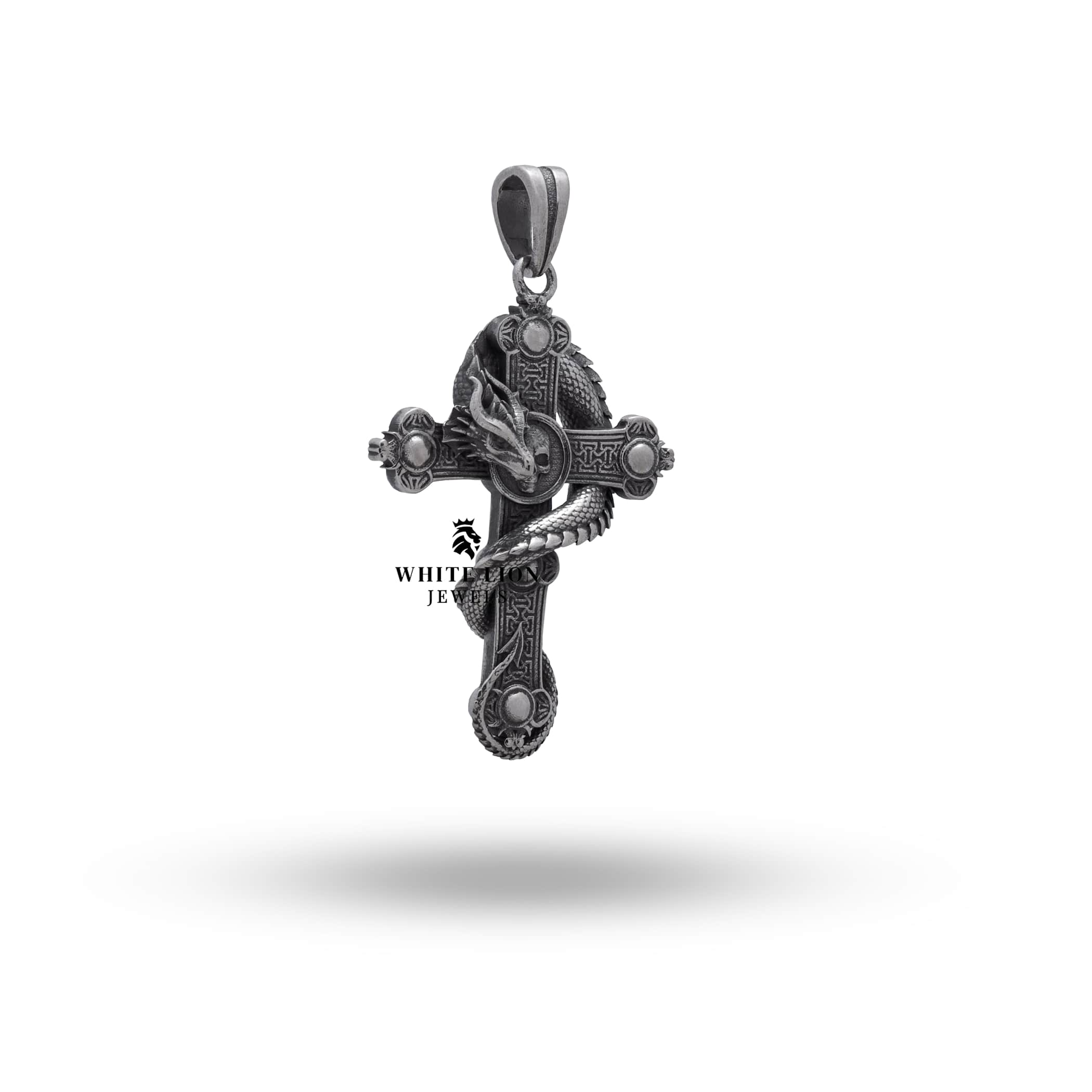 Detailed close-up of Dragon Skull Cross sterling silver pendant showcasing craftsmanship