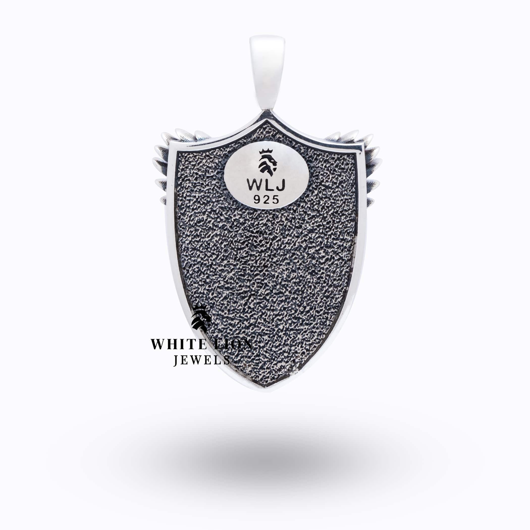 Close-up of St Michael Peiercing Devil Pendant illustrating its detailed artisan work and oxidized finish.