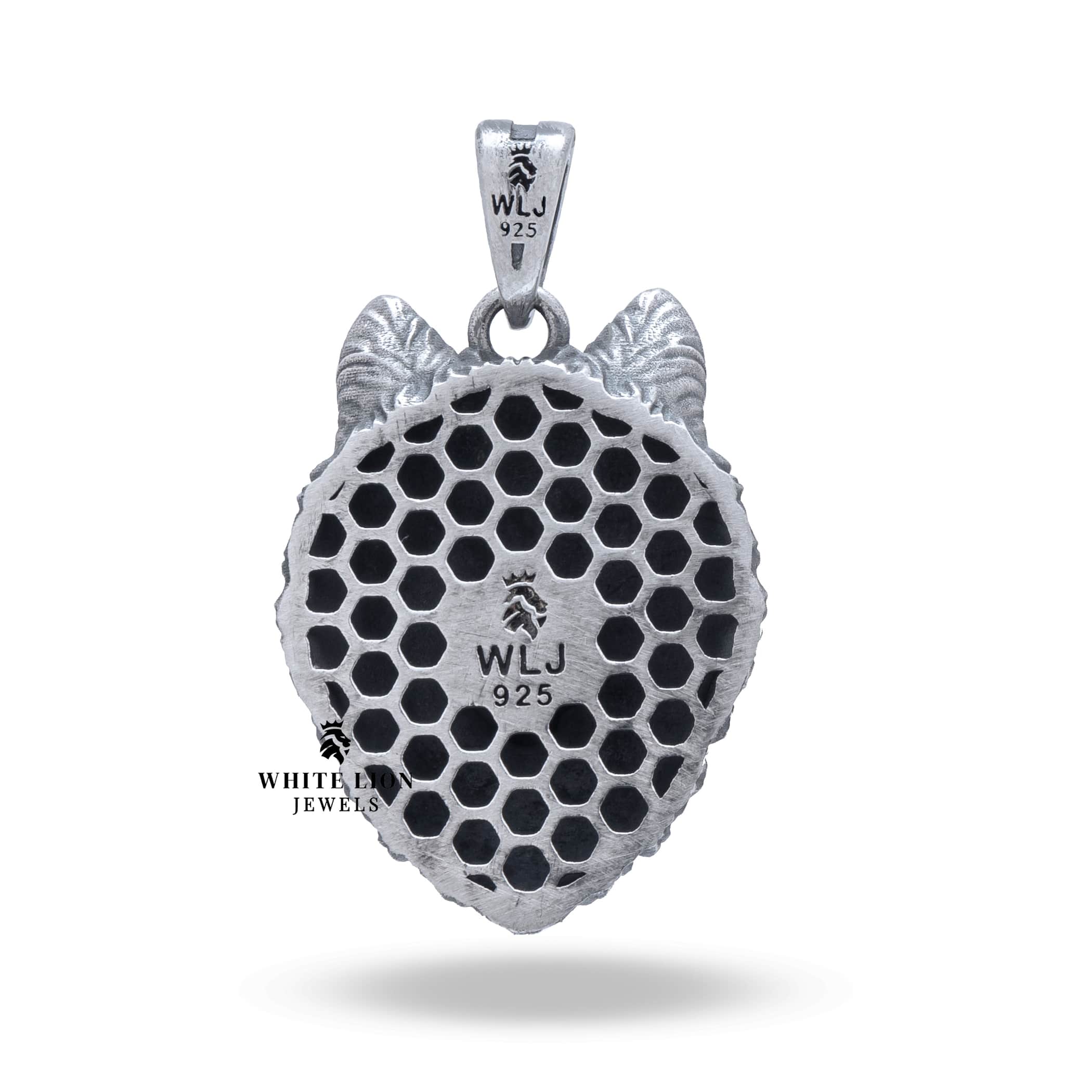 Artistic capture of a 925 Sterling Silver Wolf Head Pendant with elegant oxidized look.