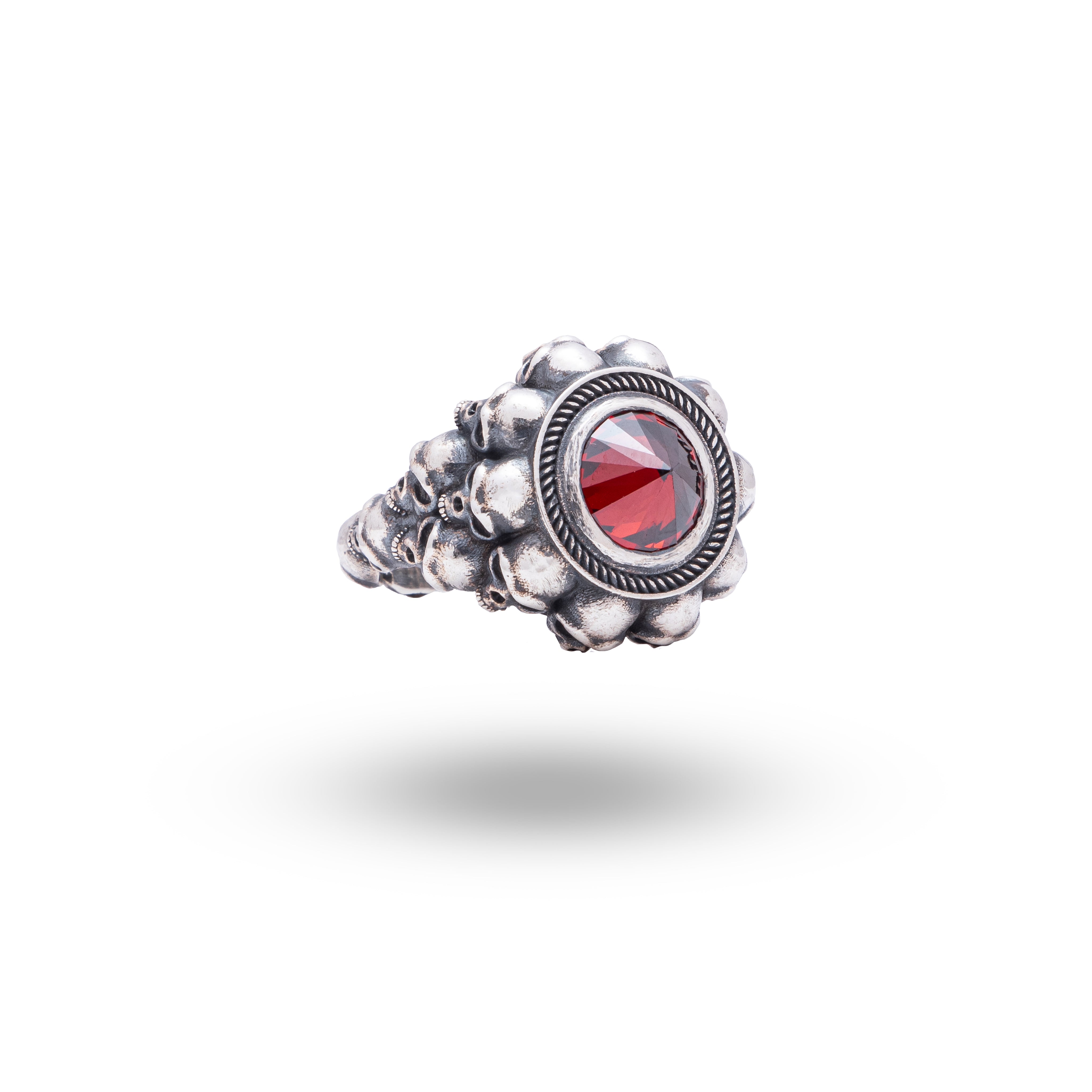 Inverted Gothic Skulls garnet stone 925 sterling silver ring showcasing oxidized silver and 10 mm garnet stone design.