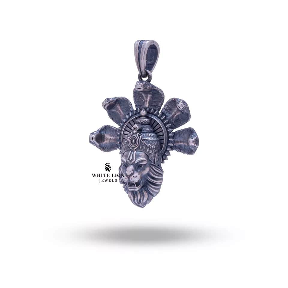 Religious avatar pendant with intricate cobra motif in silver