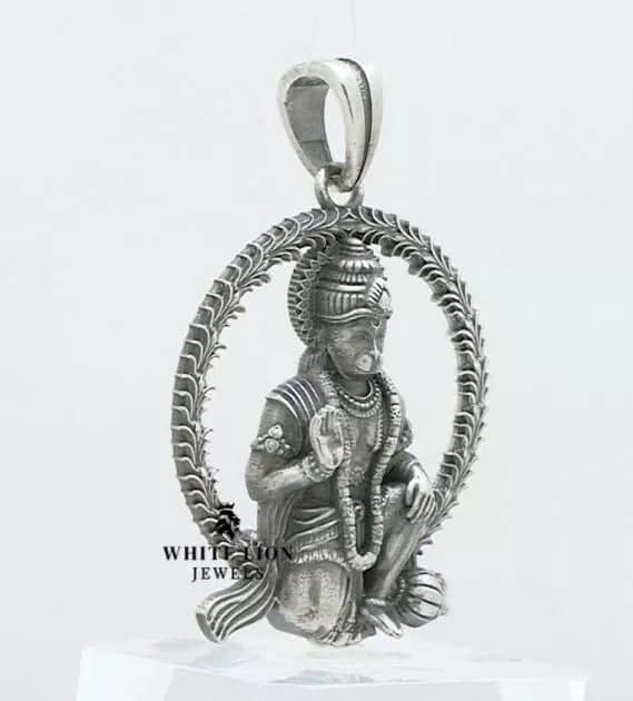 Side view of Hanuman Pendant depicting detailed artisan work in oxidized 925 Sterling Silver