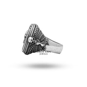 Closeup of Memento Mori Silver Ring displaying gothic skull and Gemini details.