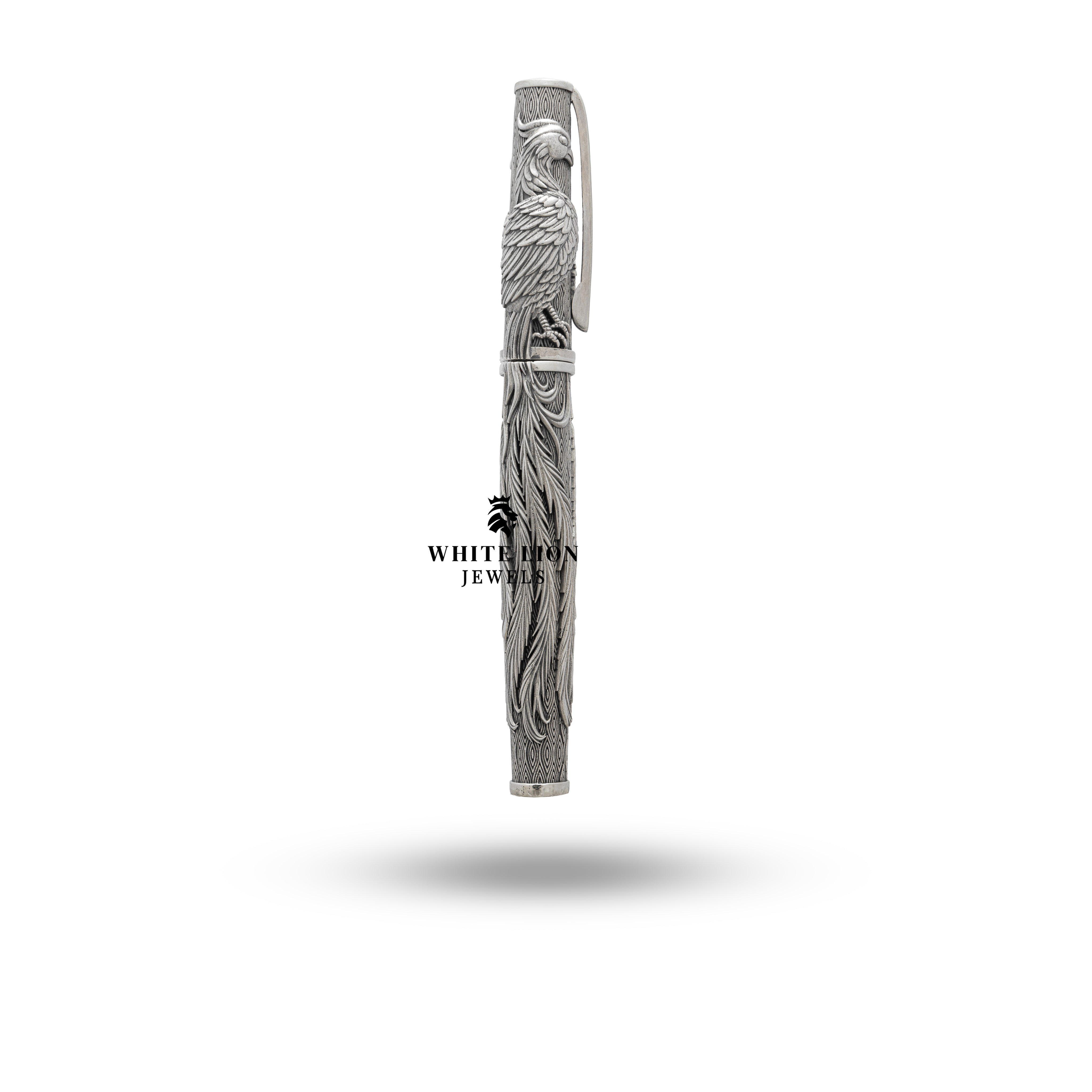 Elegant Phoenix Fire Bird Fountain Pen lying on a rich wooden desk.