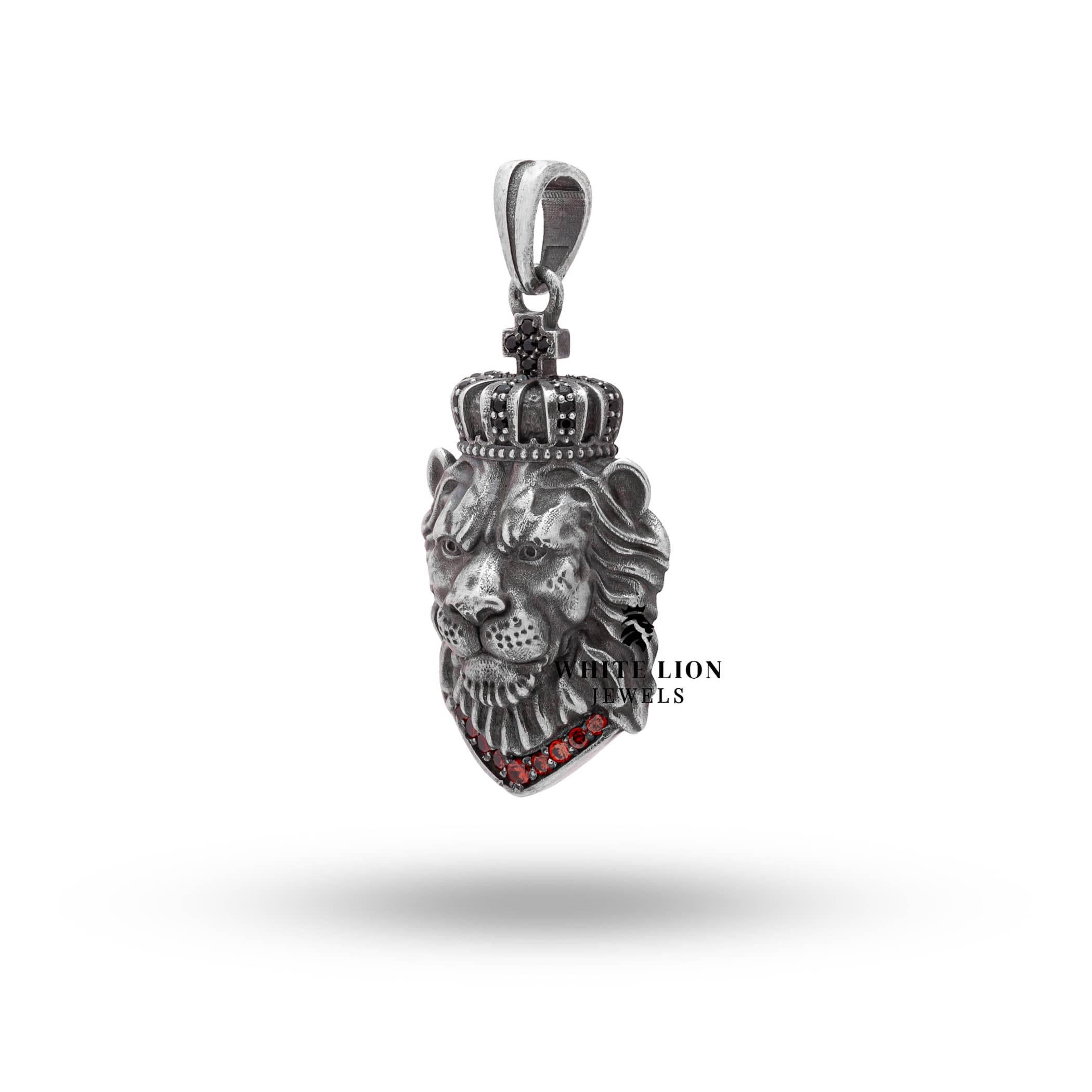 Side profile of Calm Lion King Crown Pendant, highlighting the regal crown and garnet color stones.