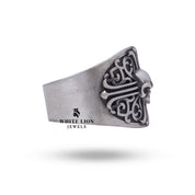 Detailed view of Cross Pattern Gothic Skull Ring depicting its skull motif in 925 sterling silver.
