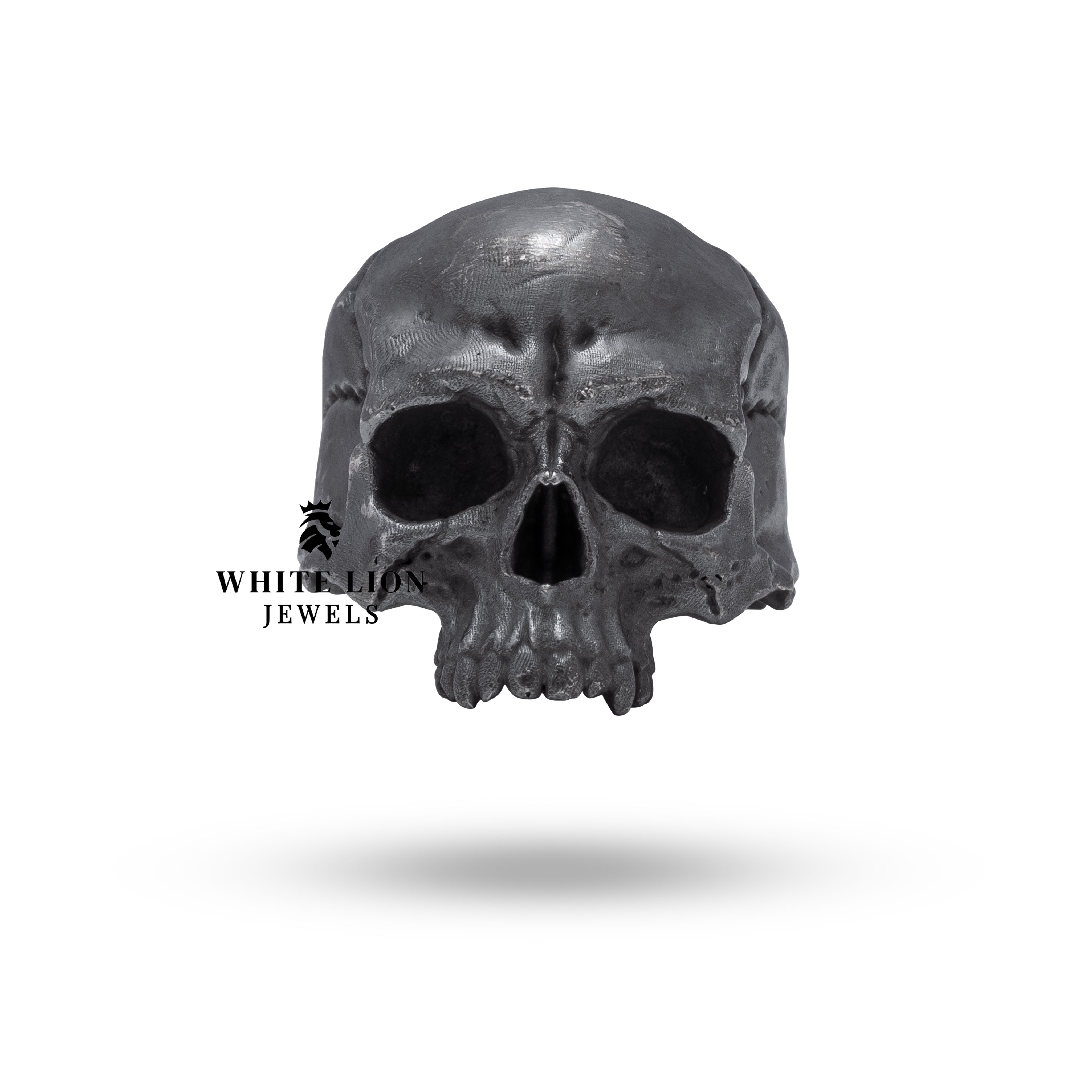 Close-up view of handcrafted 925 silver ring showing skull details