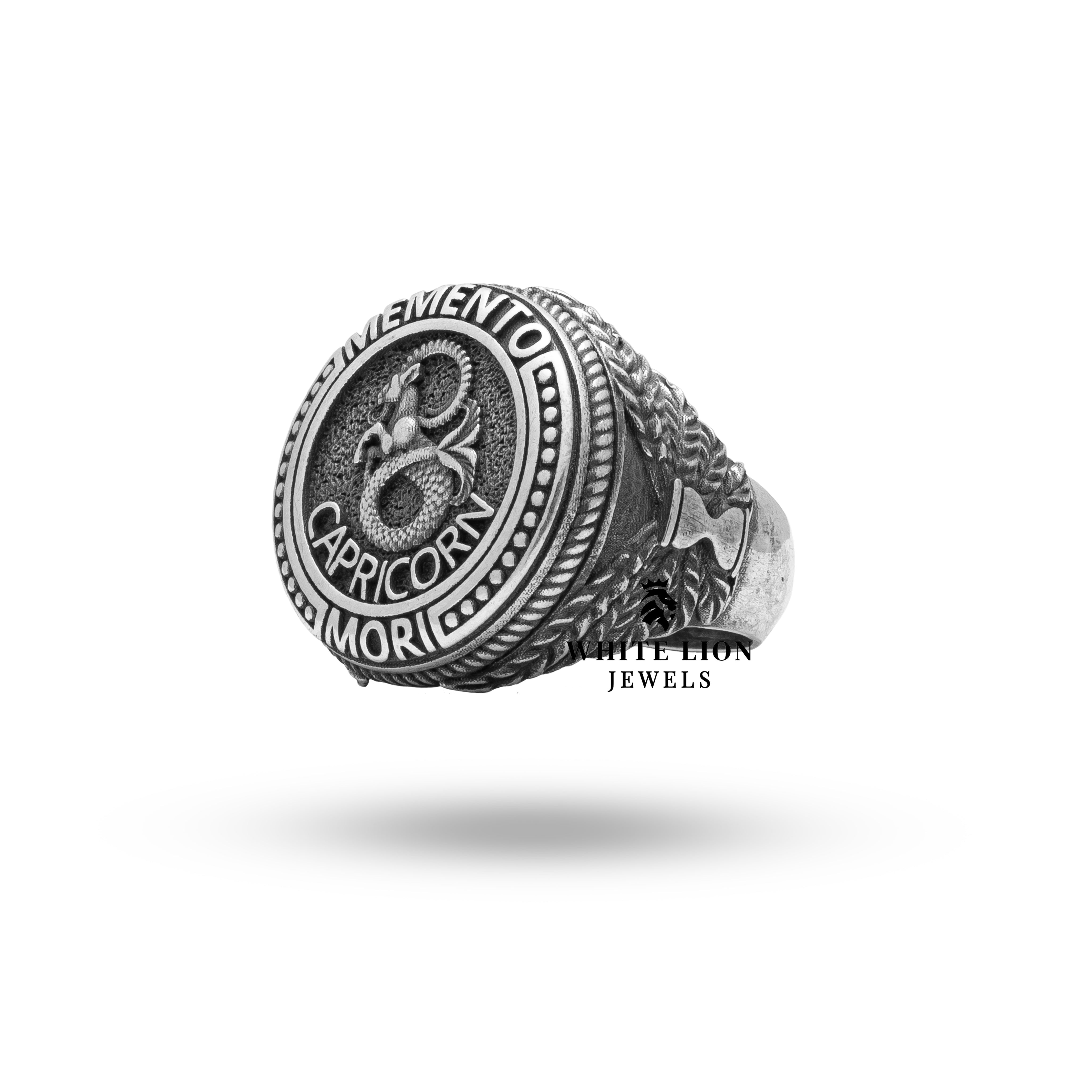 Top view showing clear protective coating and fine detailing of zodiac sign on the silver ring