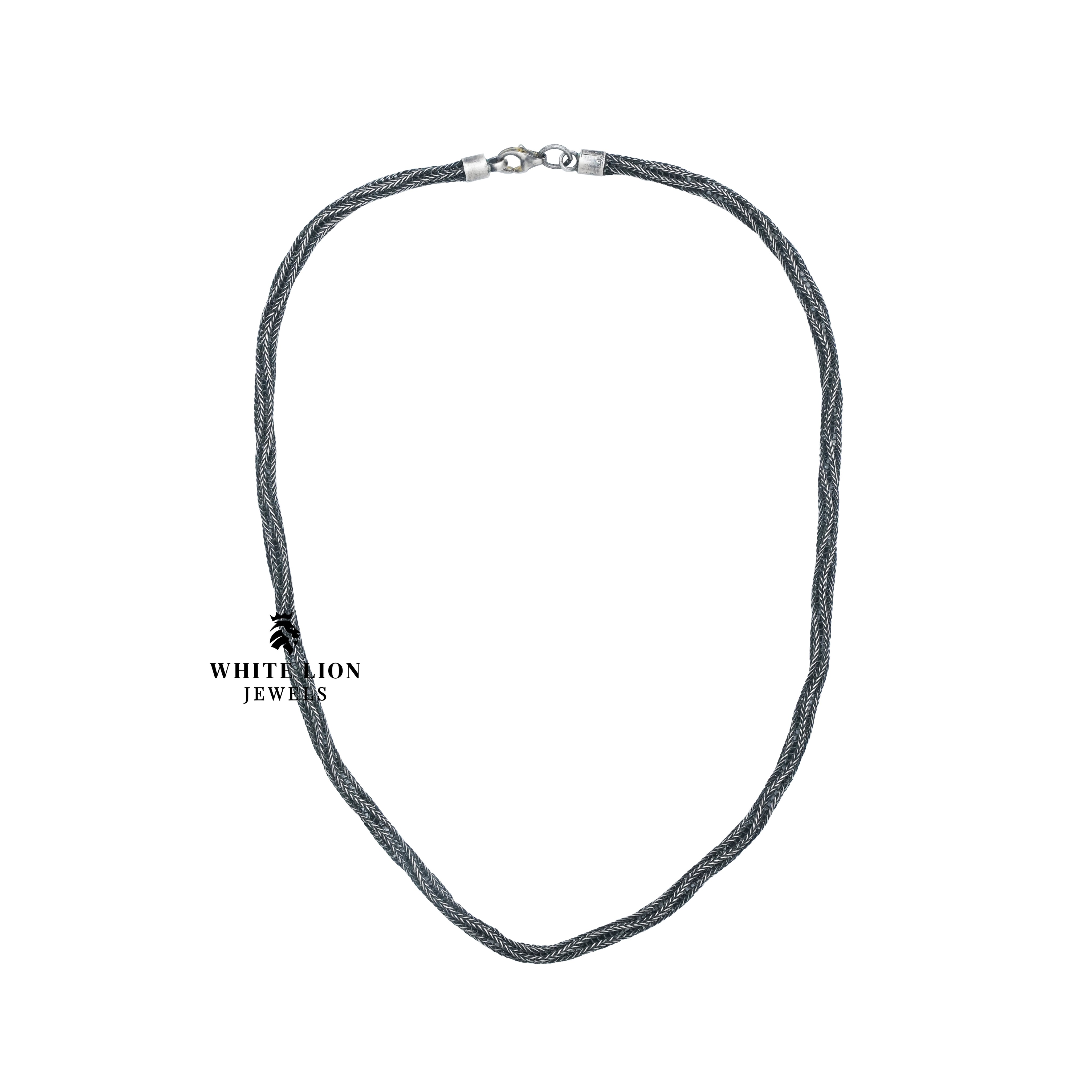 Handcrafted Netted Rope Classic Chain laid flat, displaying its beautiful texture and silver finish