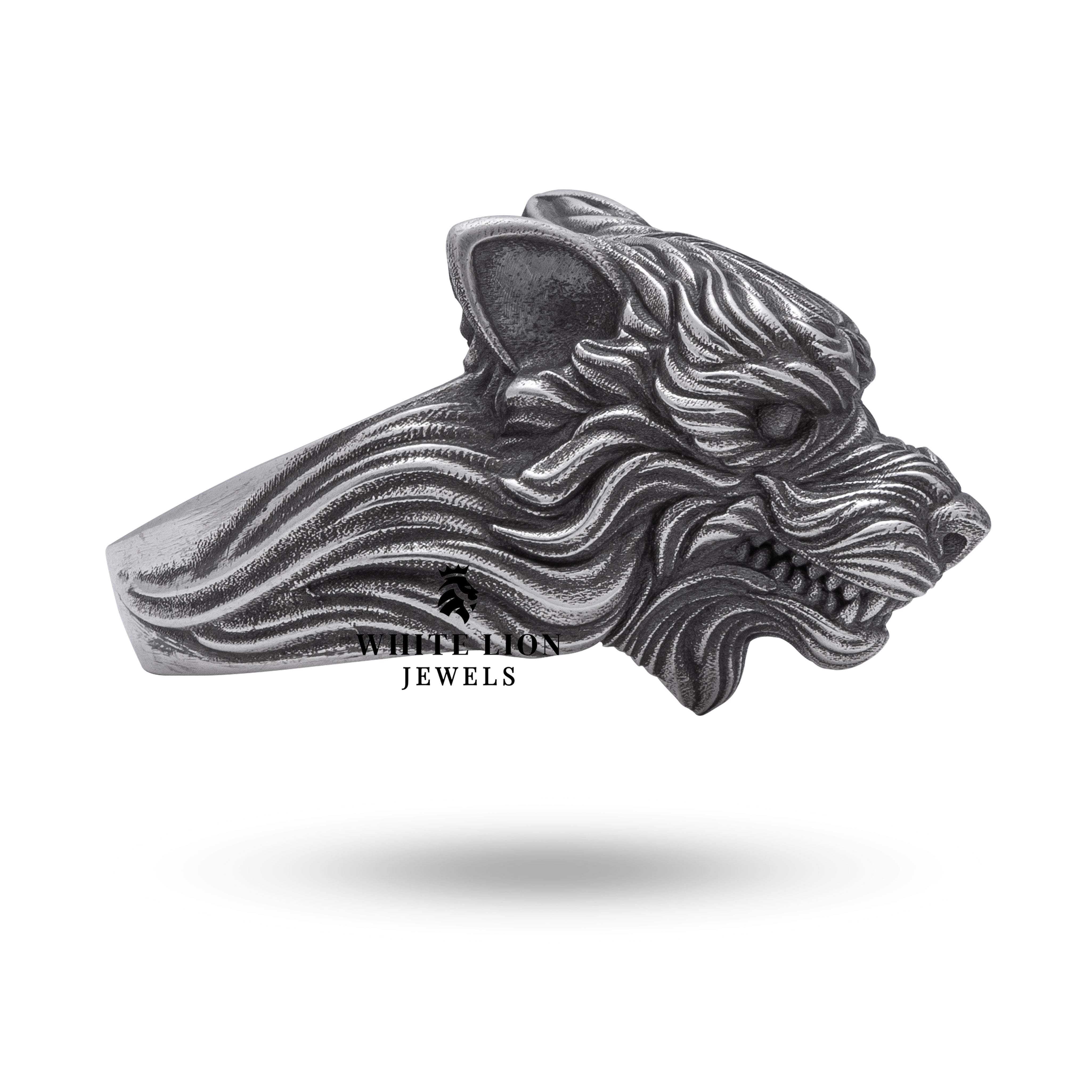 Lifestyle image of the Angry Wolf Head Silver Ring highlighting artisanal craftsmanship.