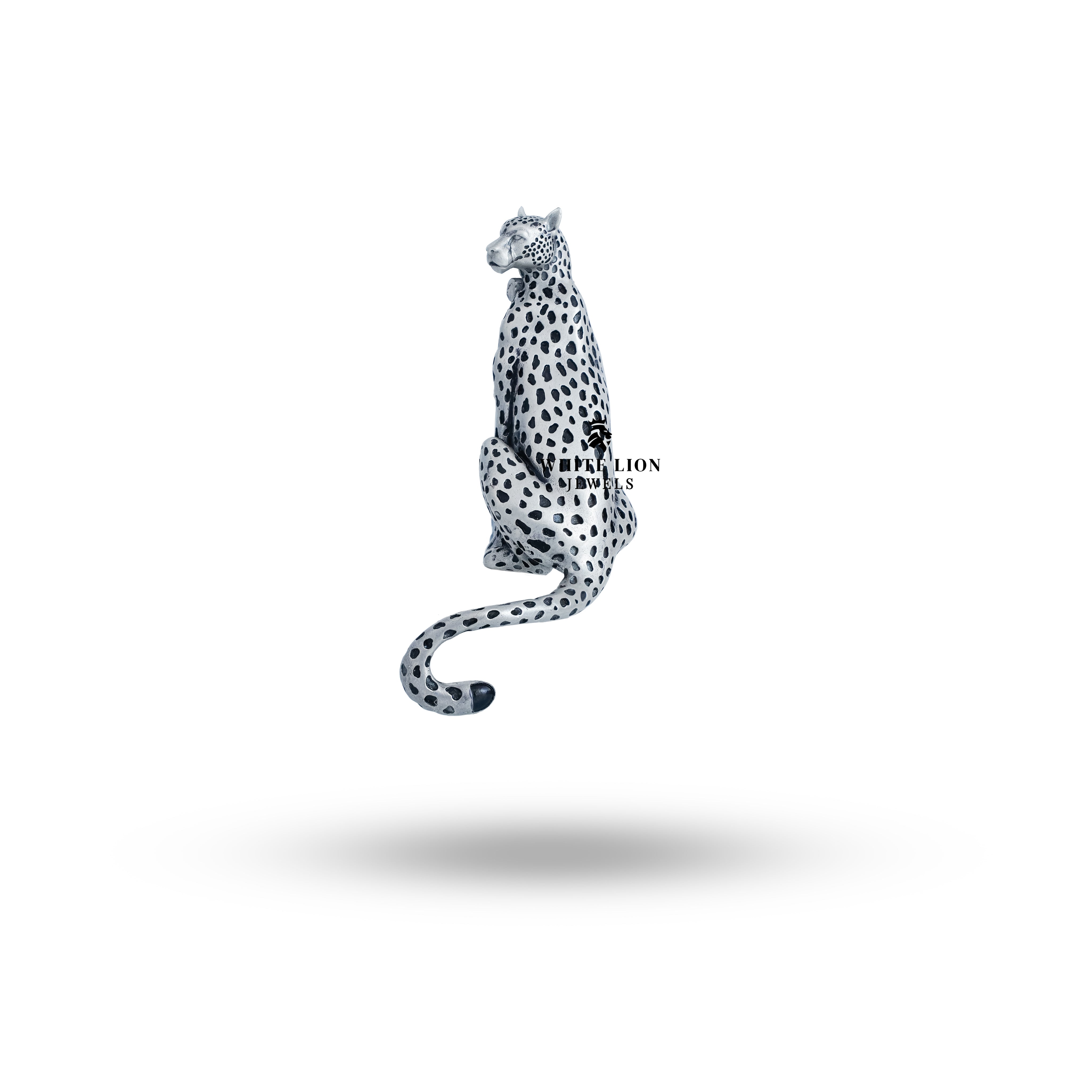 Stylish oxidized silver brooch in the shape of a panther, perfect for elegant outfits.