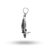 Angled shot of the oxidized oval silver Ganesha pendant.