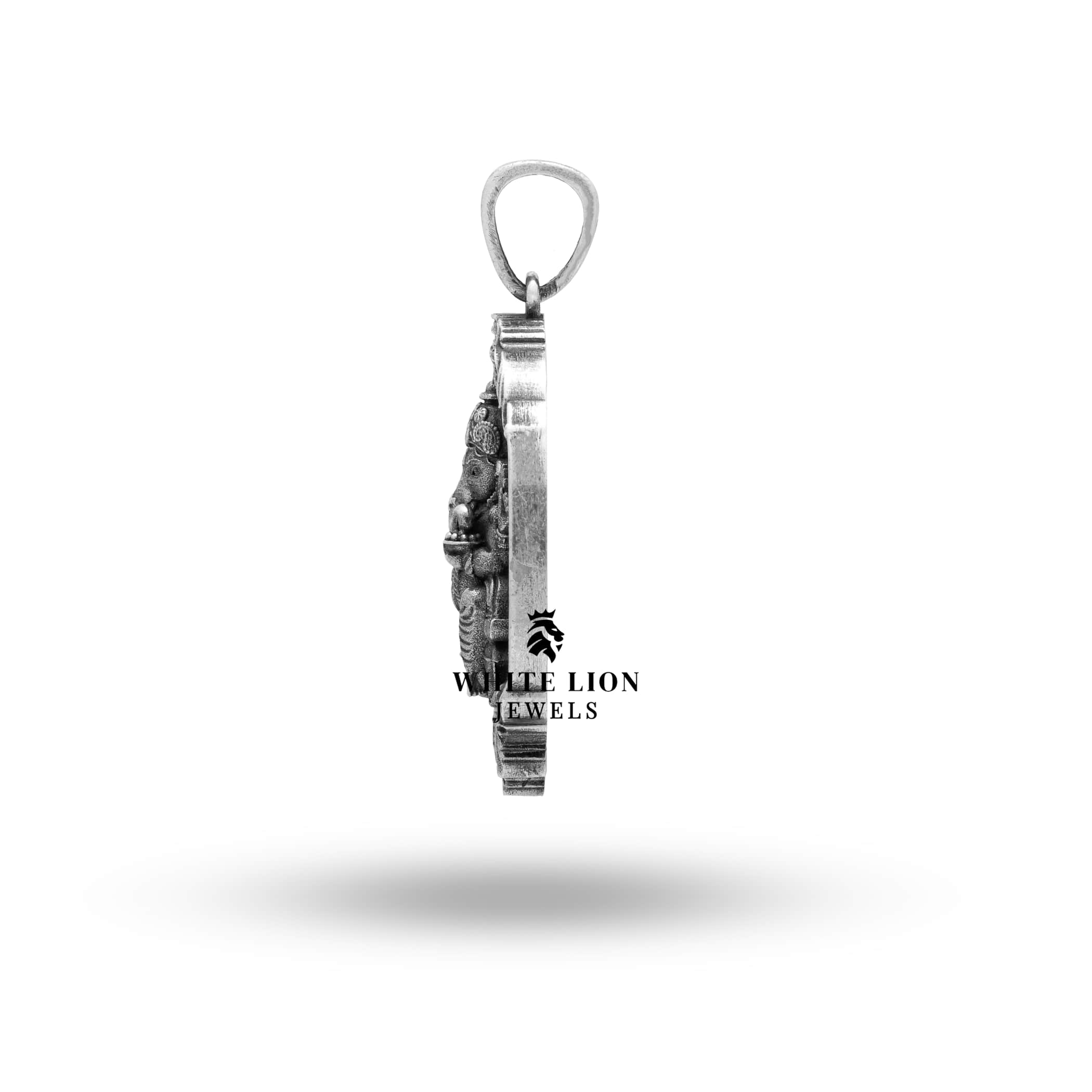 Angled shot of the oxidized oval silver Ganesha pendant.