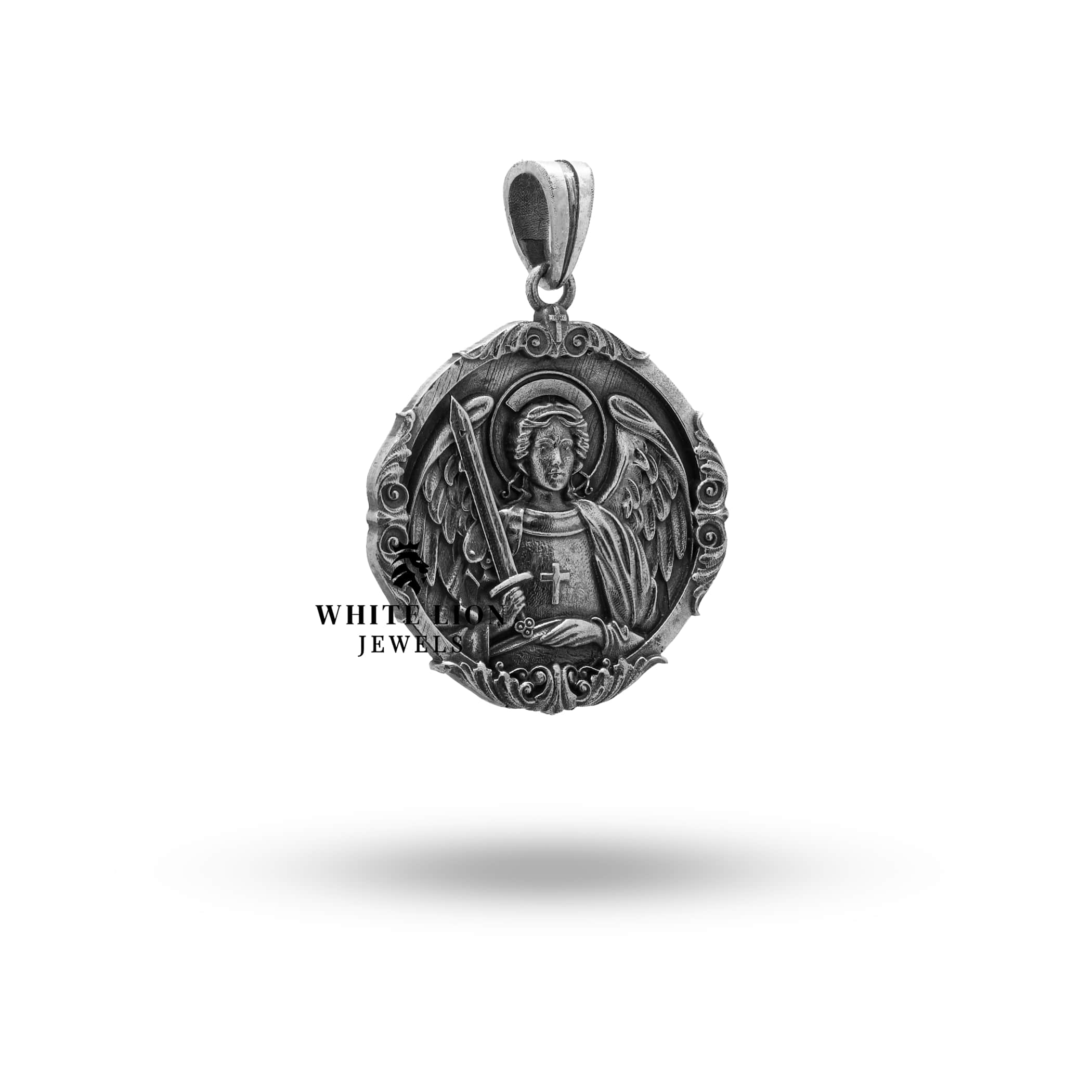 Back view of St Michael Archangel Protector Pendant showing intricate silver craftsmanship and artistry.