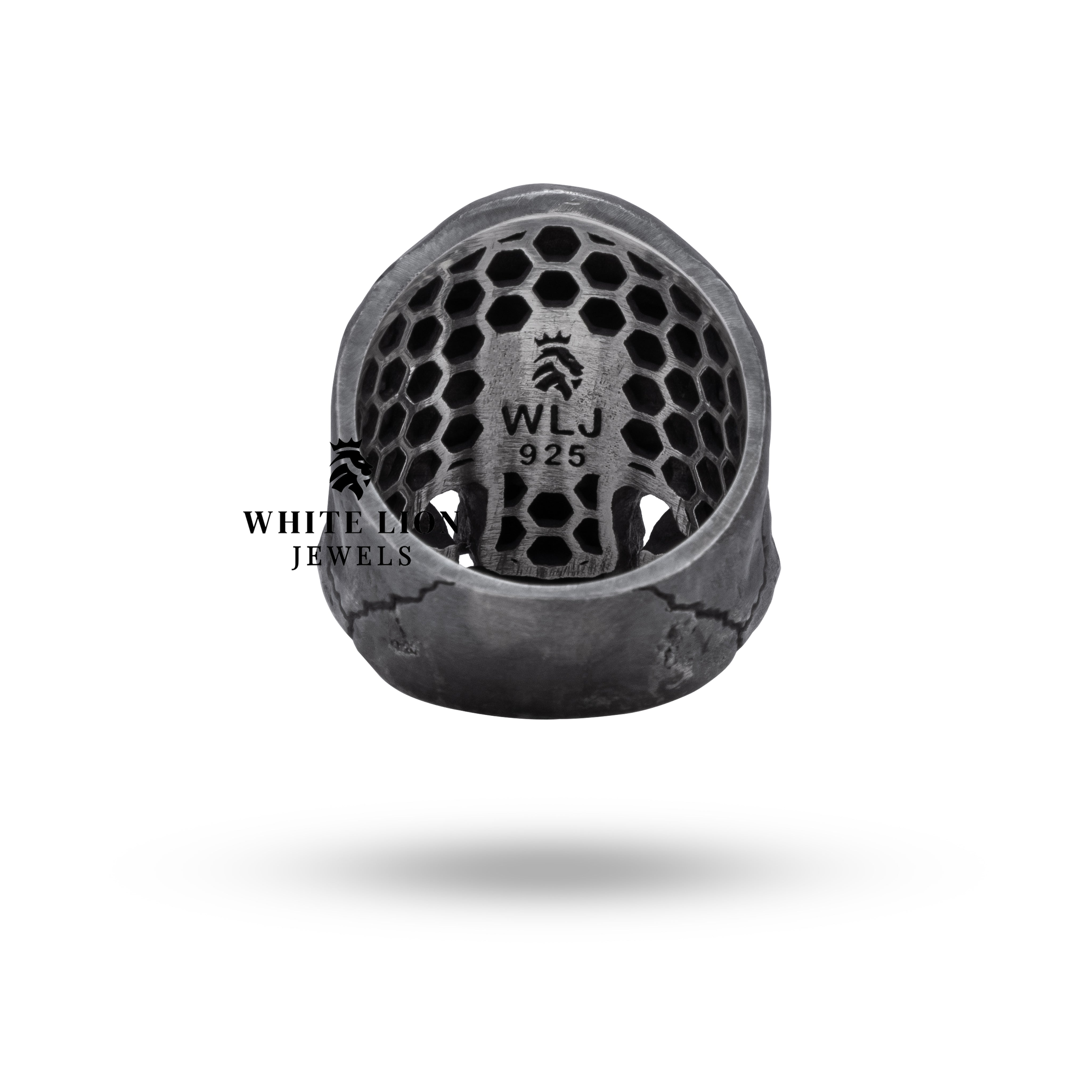 Detailed close-up of Gothic Crack Skull Ring, emphasizing craftsmanship and skull design in sterling silver.