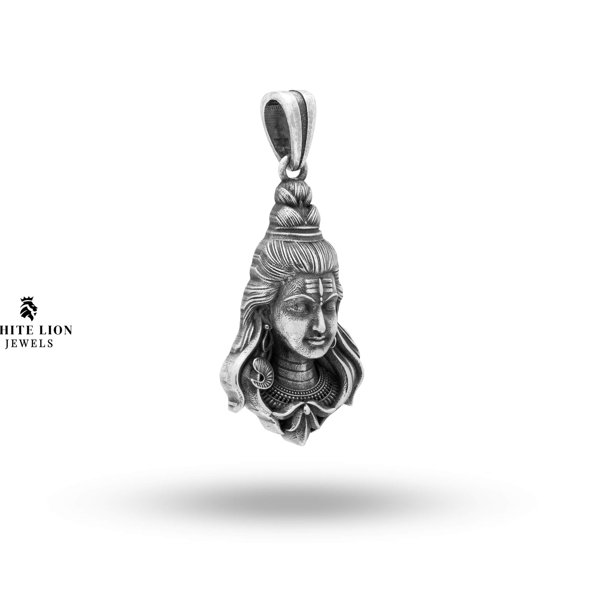 Intricate craftsmanship on oxidized silver pendant featuring Lord Shiva's Third Eye.