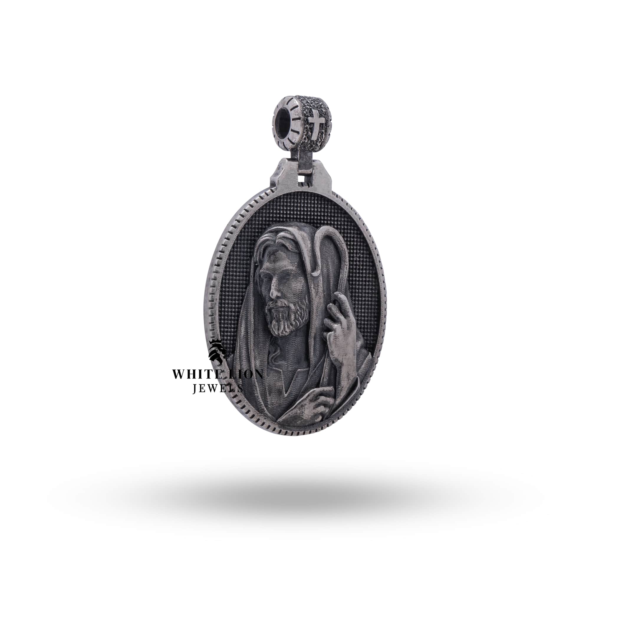 Oval-shaped oxidized silver pendant featuring Jesus as the Good Shepherd