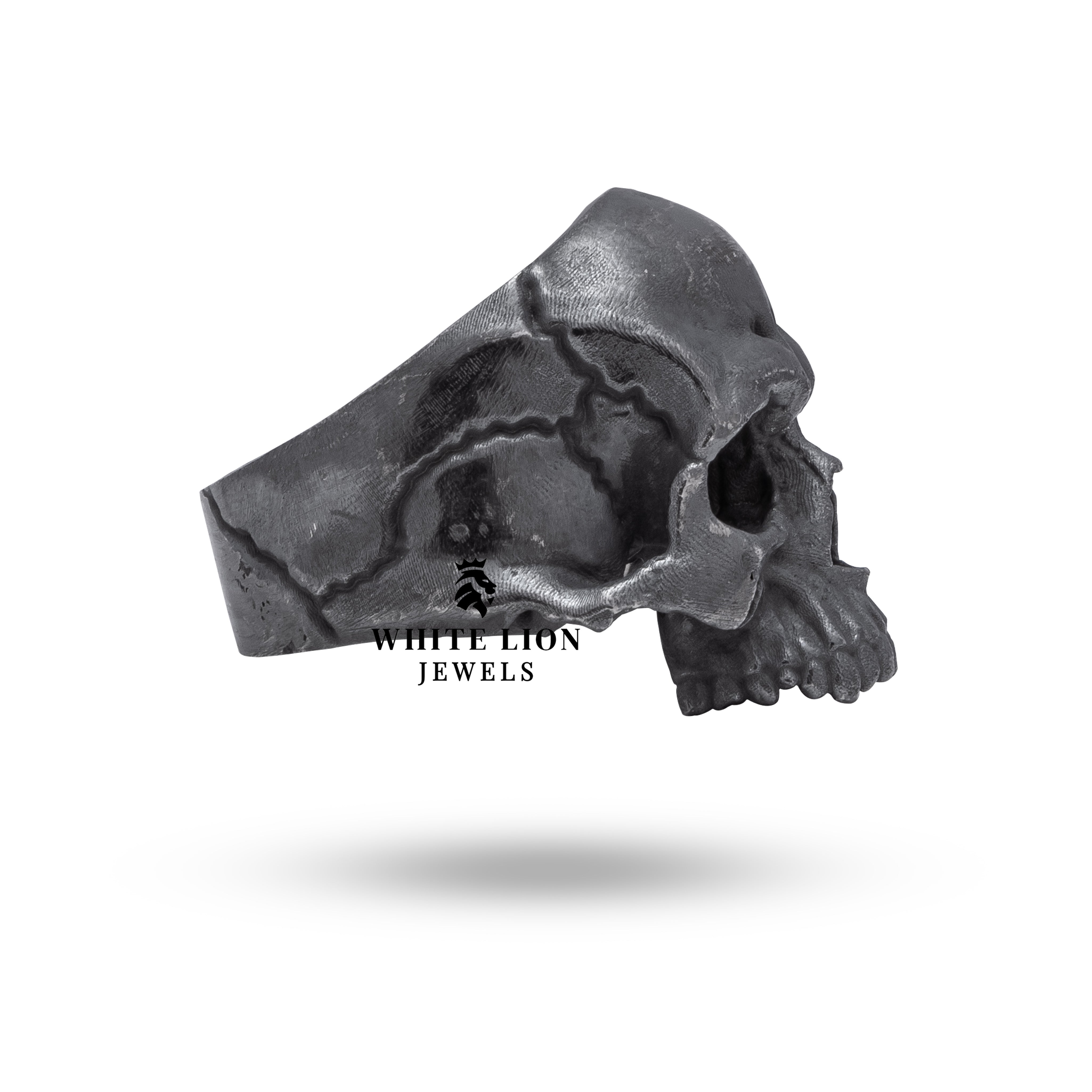 Side view of oxidized silver skull-themed ring with detailed craftsmanship