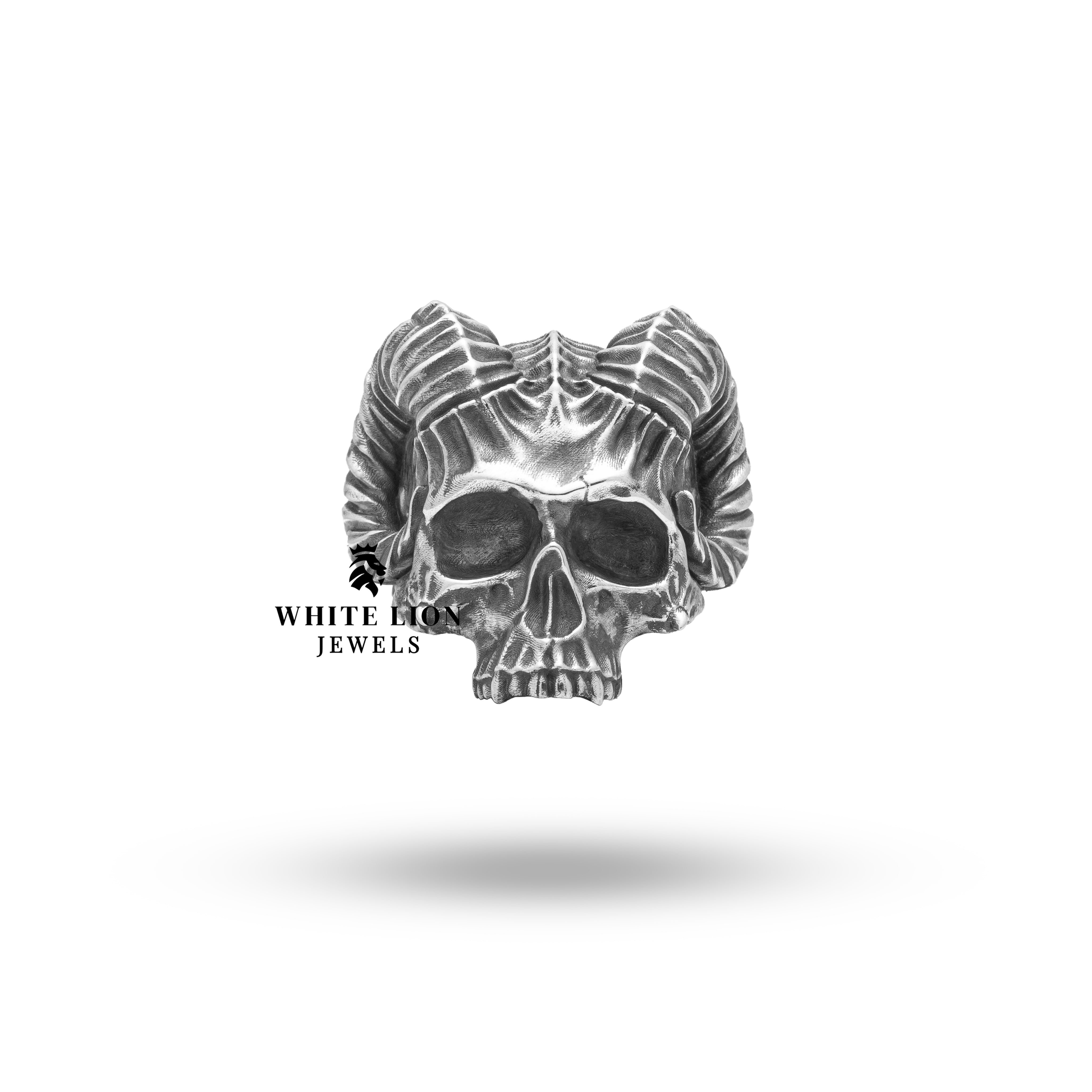 Close-up view of the detailed horned demon half jaw on a sterling silver gothic skull ring.