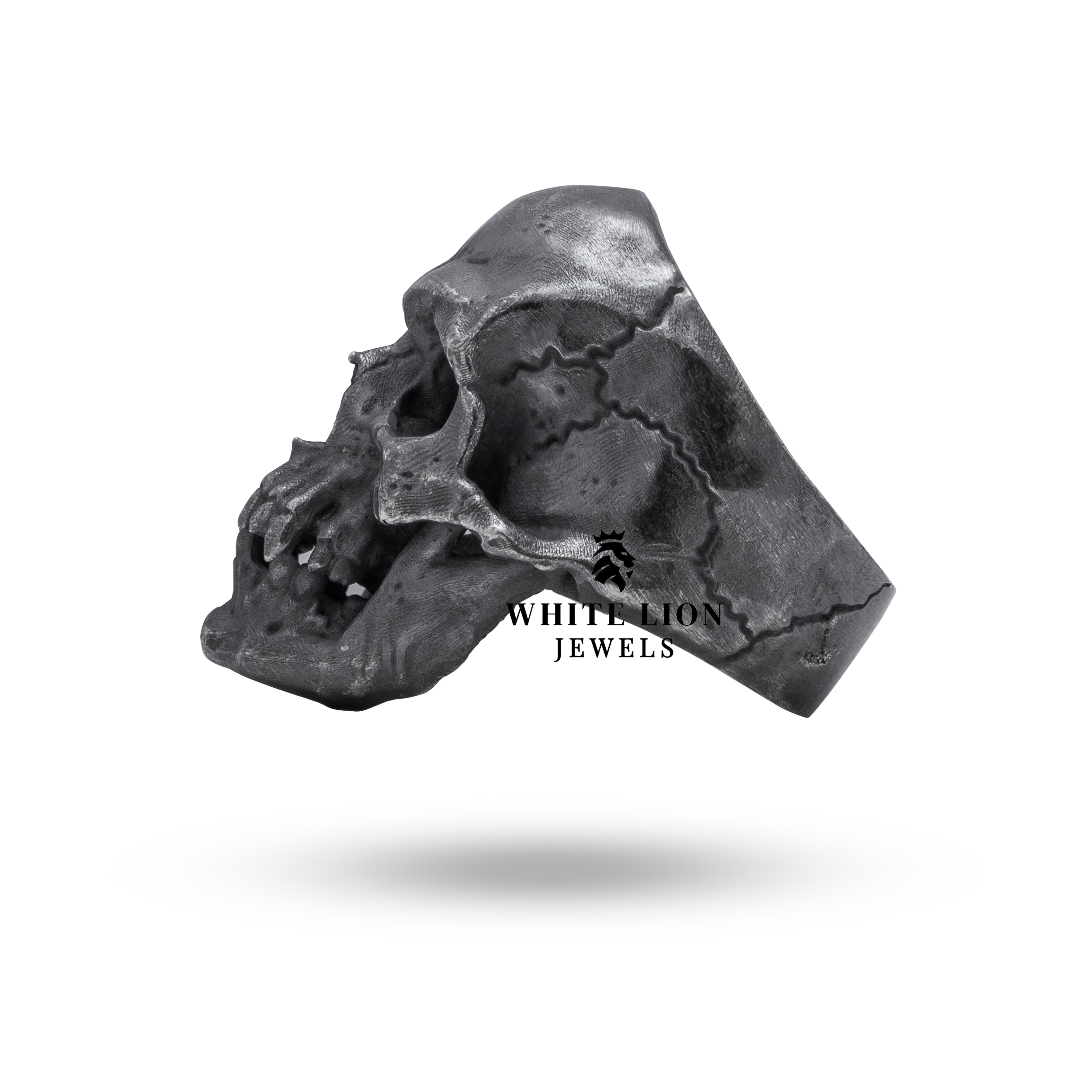 Angle view of Gothic Crack Skull Ring, highlighting handcrafted details in oxidized 925 sterling silver.