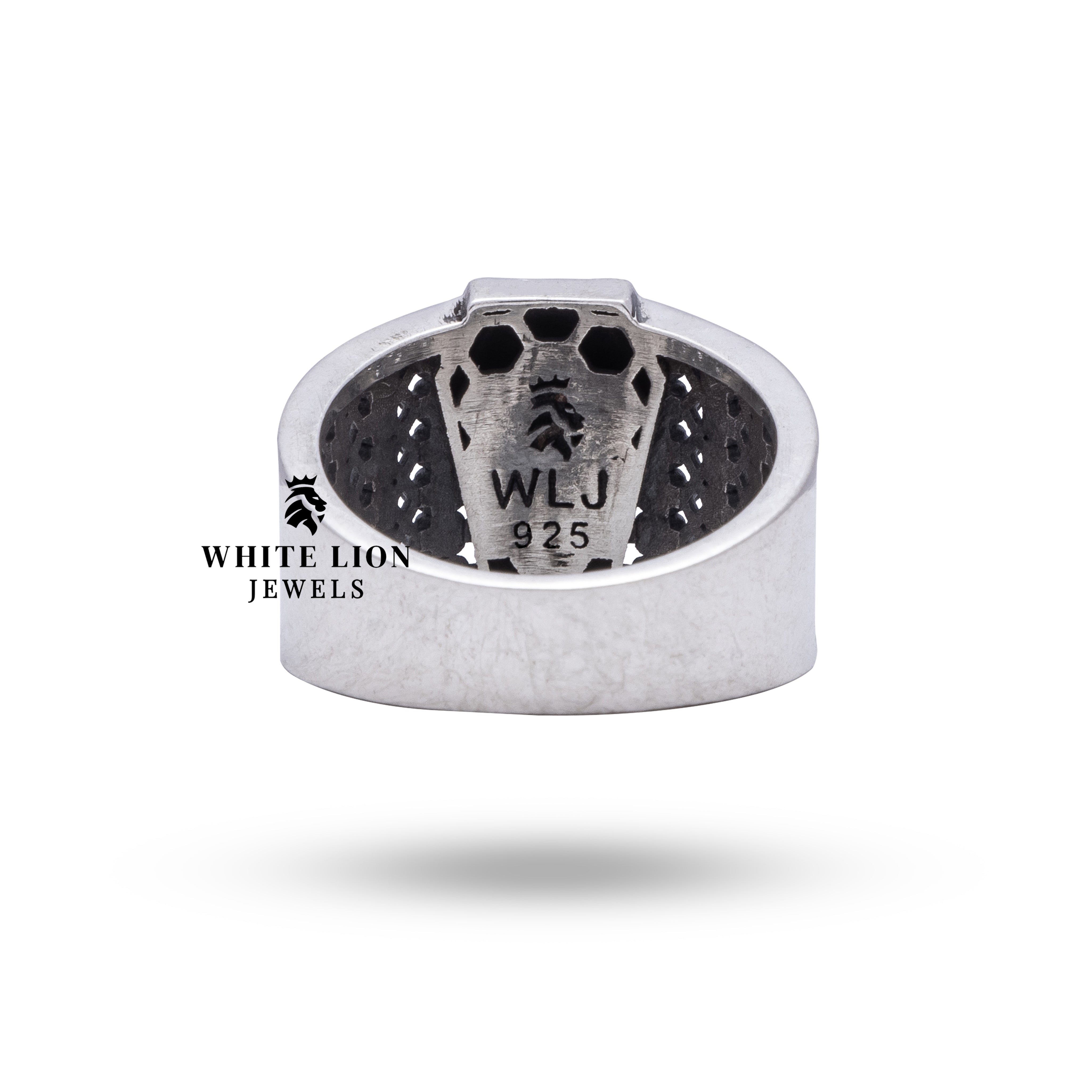 Angled shot of Coffin Dead Box Skulls Ring, illustrating its artisan craftsmanship