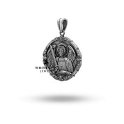 Side view of the St Michael Archangel Pendant highlighting the thickness and round shape of oxidized sterling silver.
