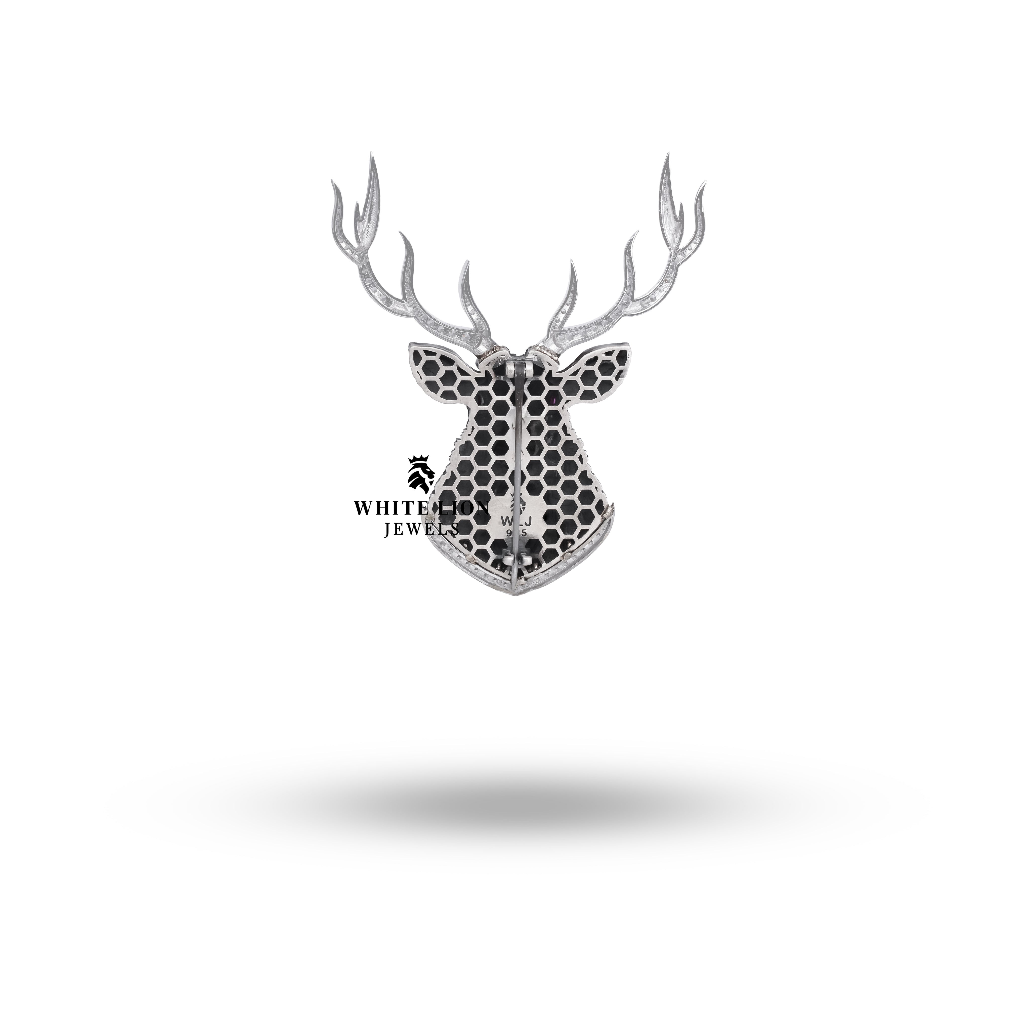 Close-up detail of the sparkling cubic zirconia stones in the horns of the Royal Black Deer Brooch.
