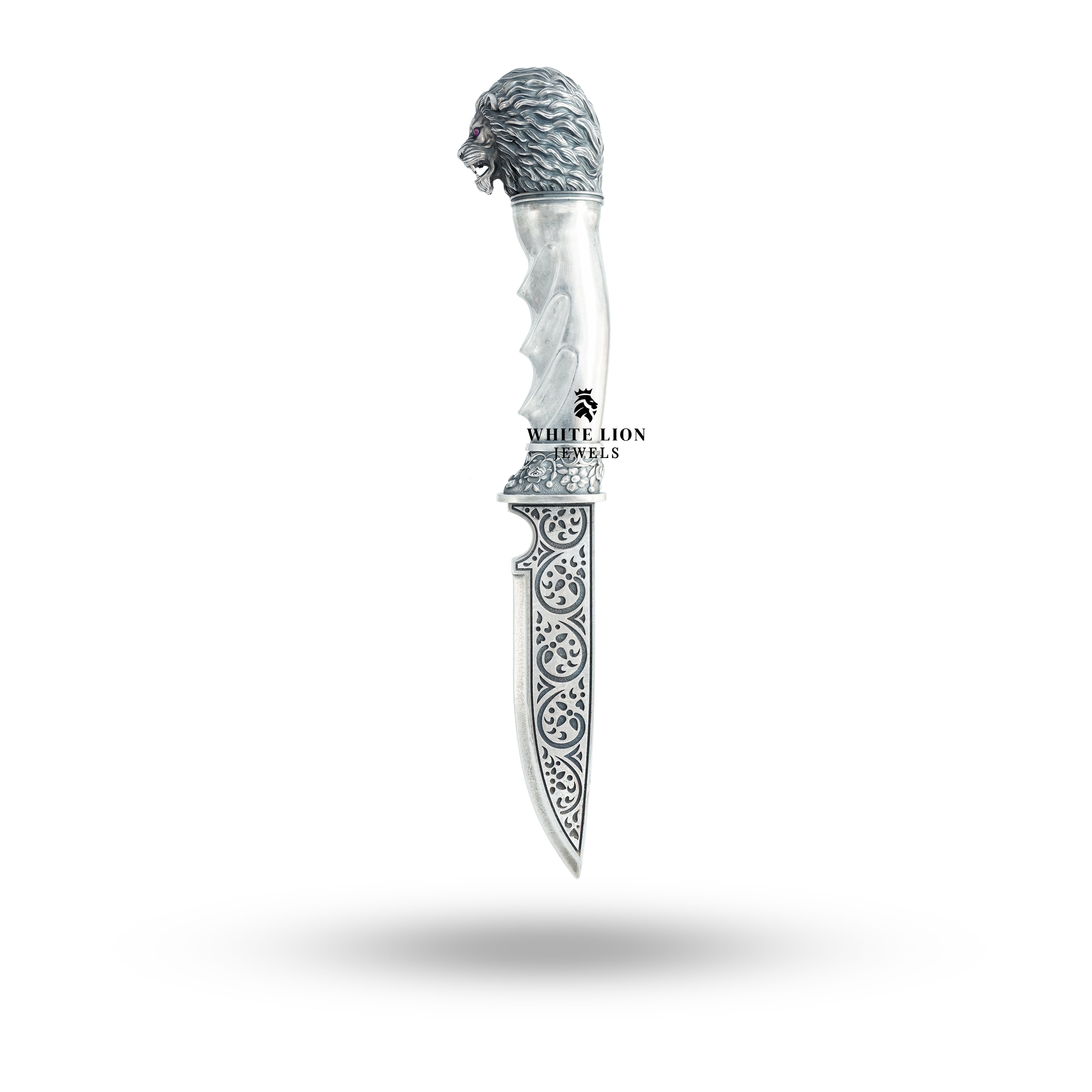 Closeup detail of the lion head engraving on the Sterling Silver Katar.