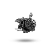 Artisan crafted love symbol rose flower brooch in sterling silver elegance.