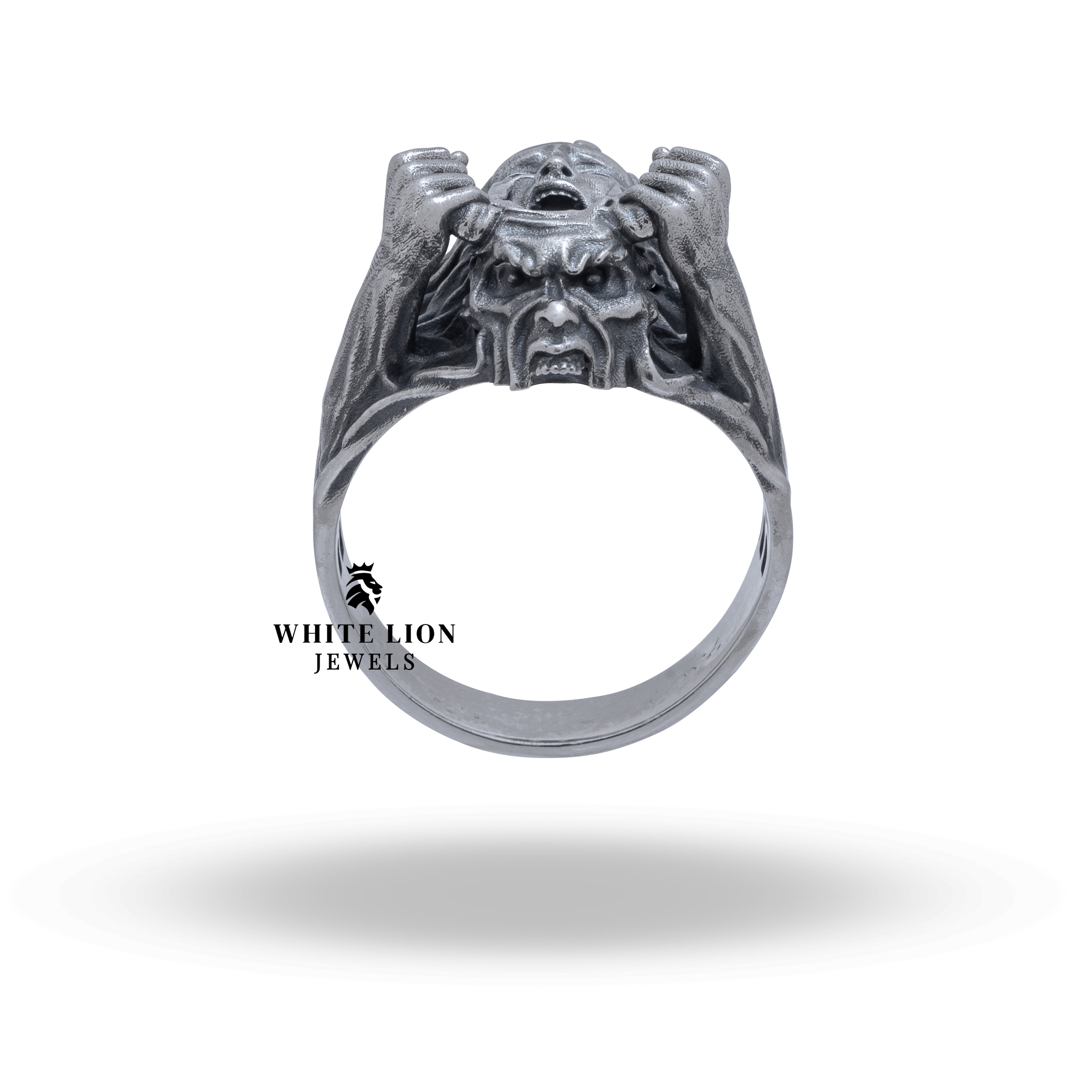 The Scream Mask Transformation 925 sterling silver ring displayed on a finger highlighting its bold presence.