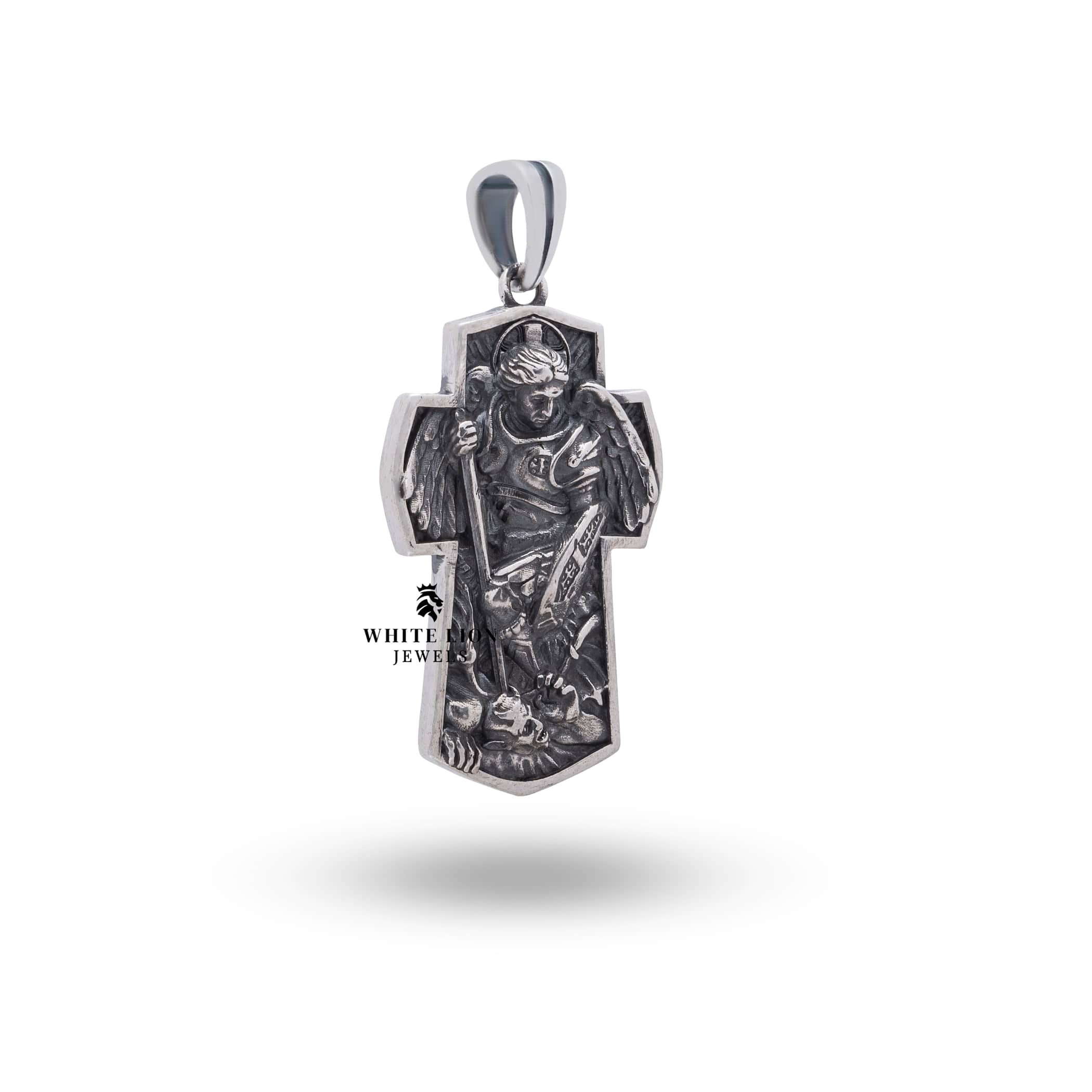 Oxidized silver pendant depicting the St Michael Archangel, designed with artisanal craftsmanship from White Lion Jewels.