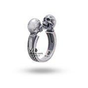 Angled view of the Open Jaw Twin Skull 925 Sterling Silver Ring illustrating its unique open-jaw design.