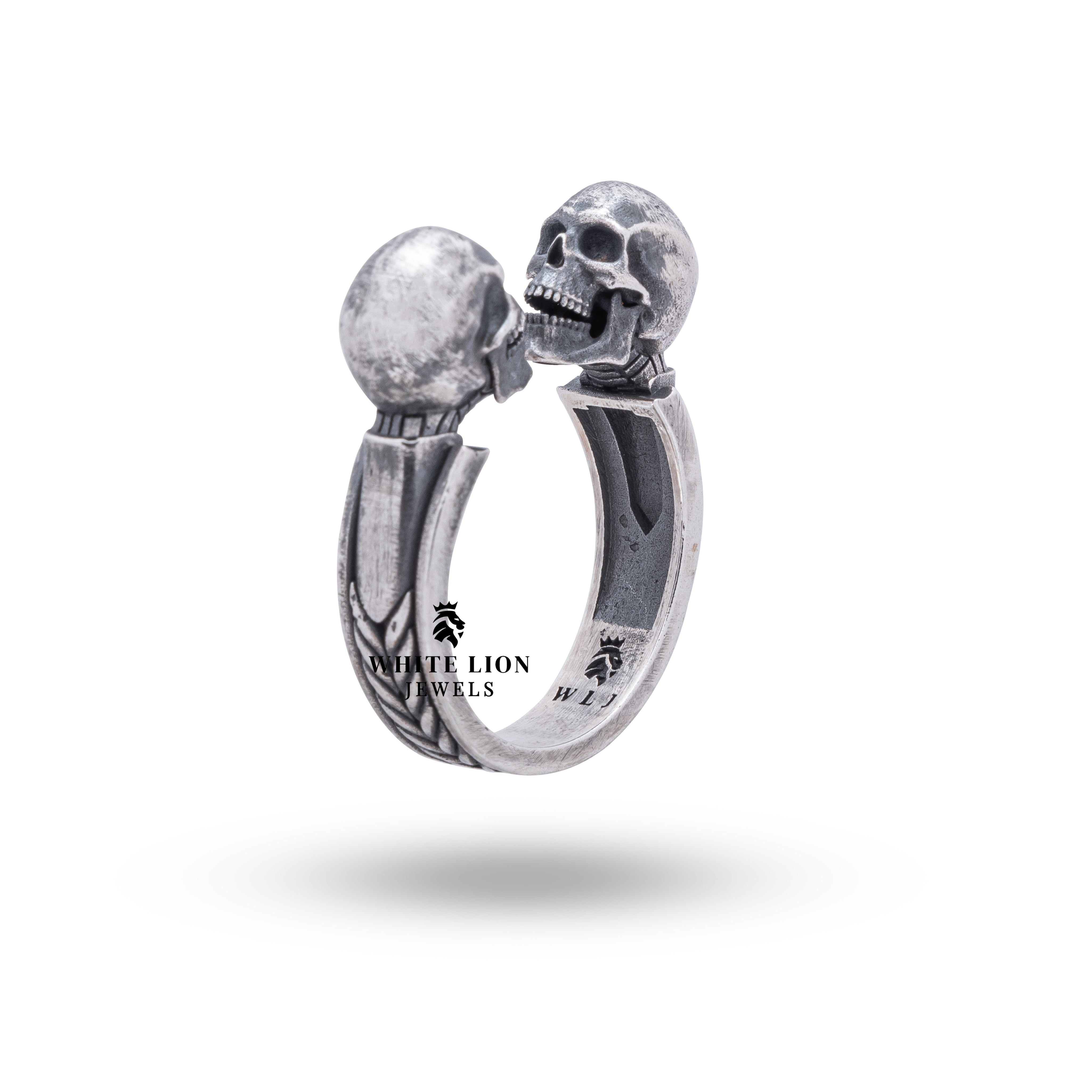 Angled view of the Open Jaw Twin Skull 925 Sterling Silver Ring illustrating its unique open-jaw design.