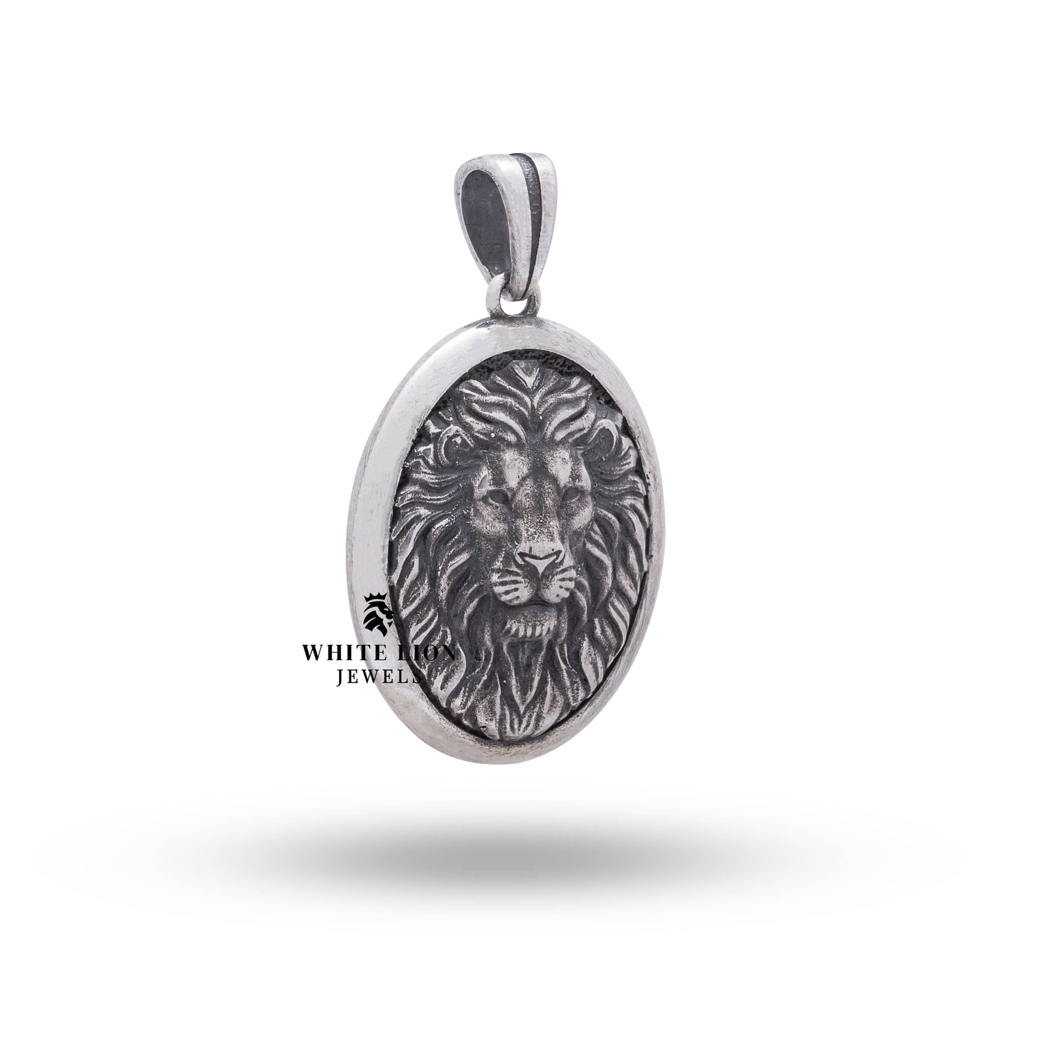 Side profile of oxidized silver oval pendant with lion motif