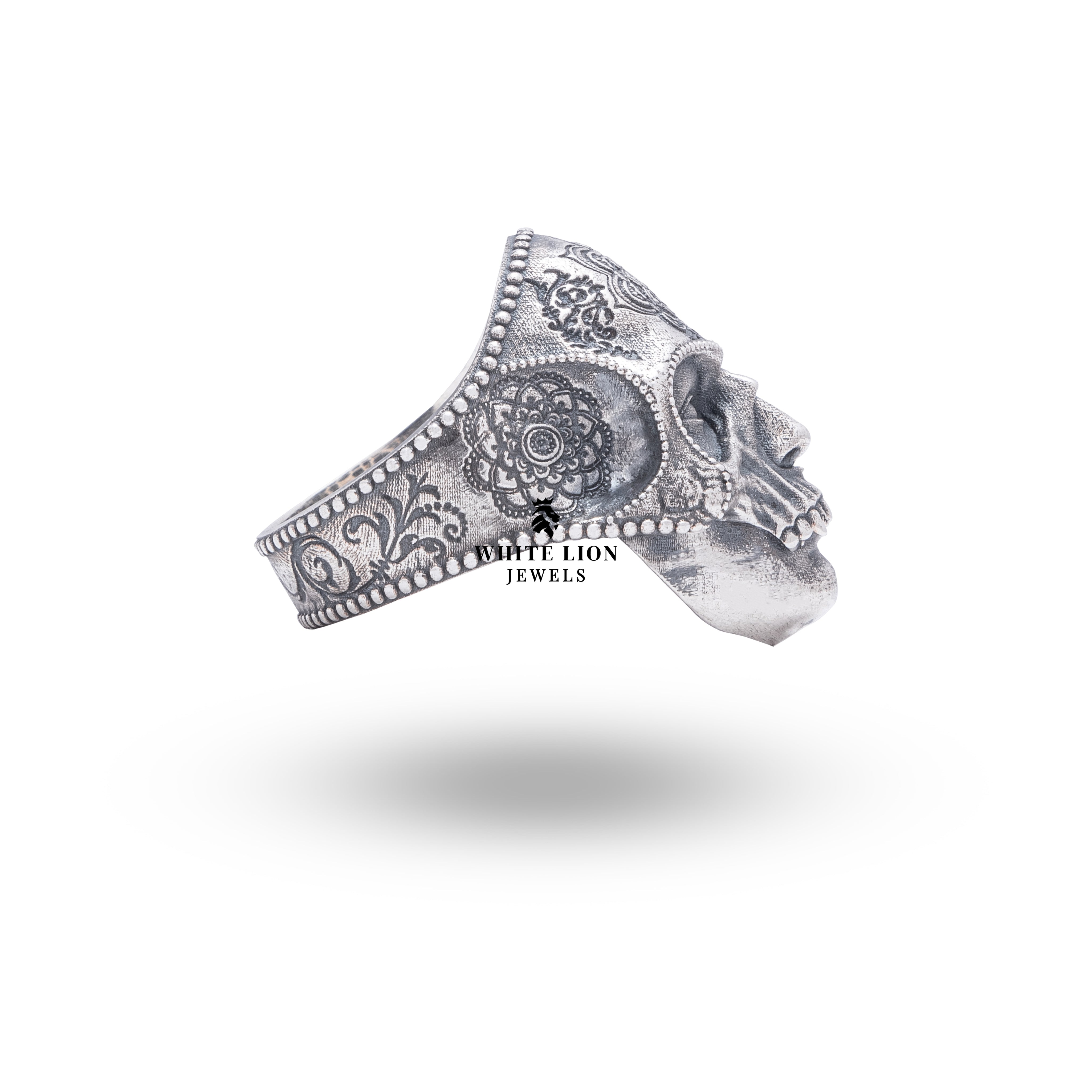 Close-up showing mandala and gothic skull design of sterling silver ring