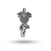 Close-up of Medusa and serpentine design on sterling silver pendant, highlighting detailed artistry and oxidized appearance.