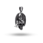 Close-up of dragon wings skull detailing in sterling silver pendant