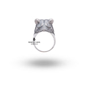 Feminine Bear 925 Sterling Silver Ring set against a rustic background